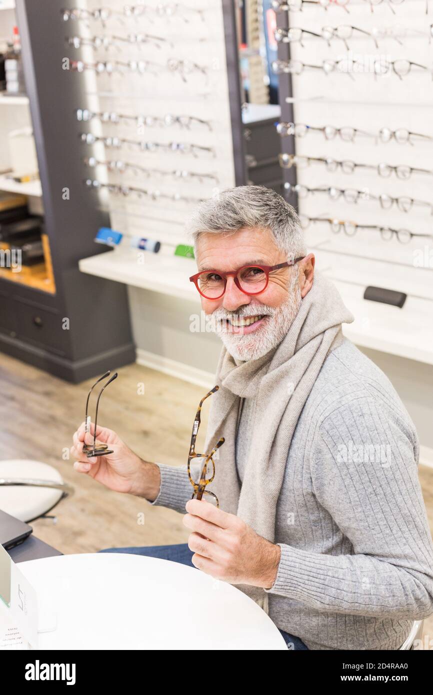 Man trying prescription glasses. Stock Photo