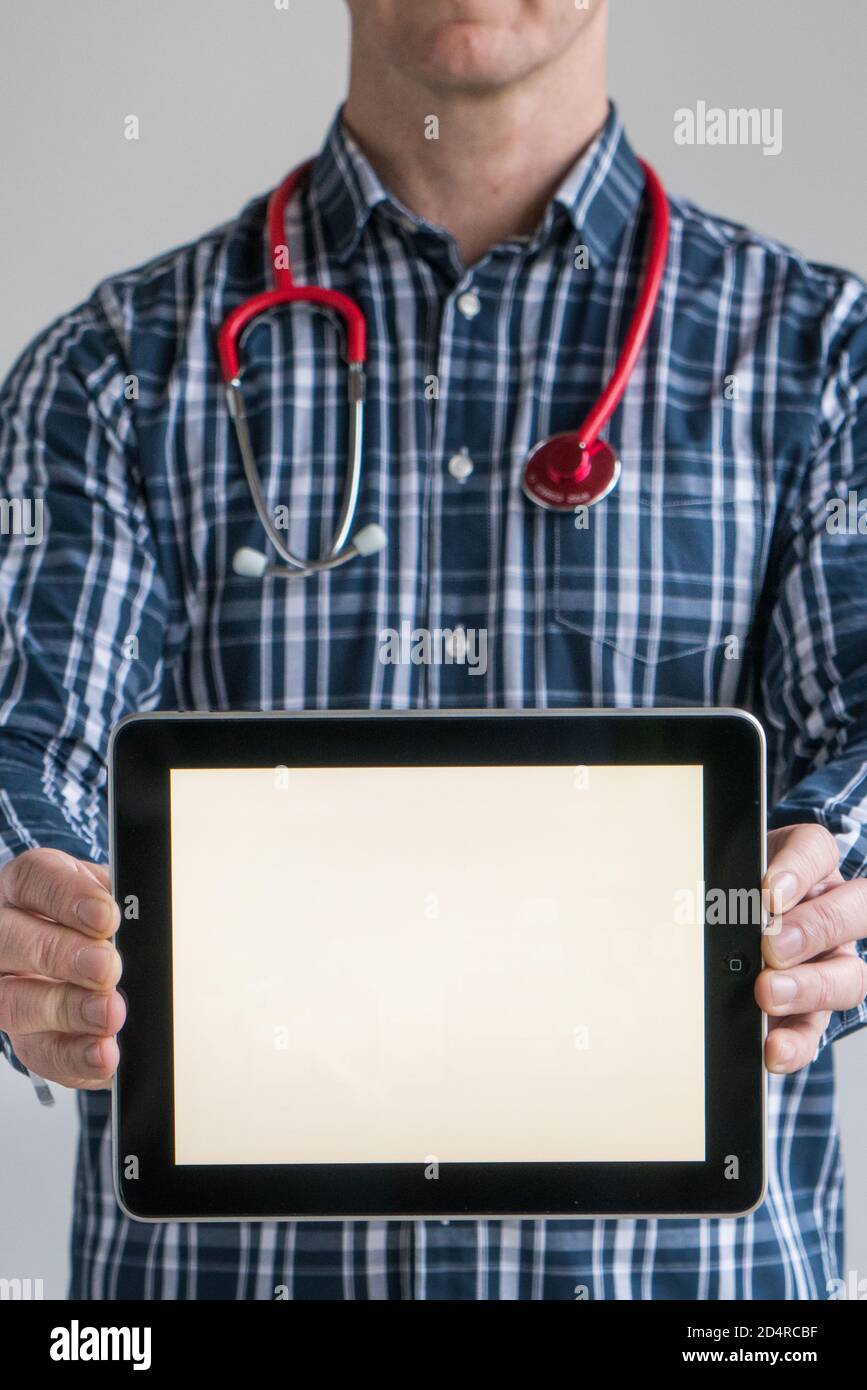 Doctor holding a digital tablet. Stock Photo