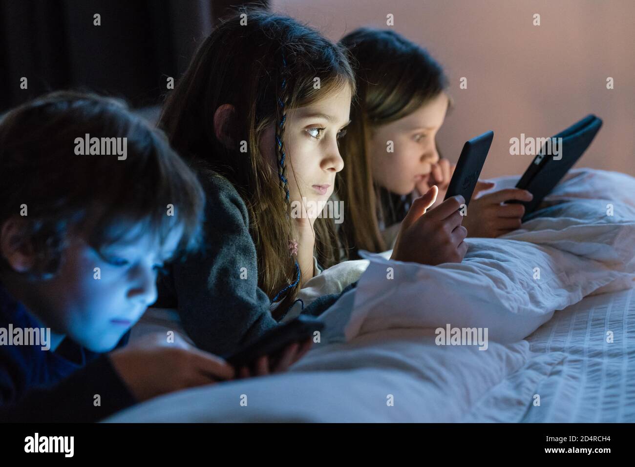 Kids Using Android Children using a smartphone, a digital tablet and e-reader Stock Photo ...