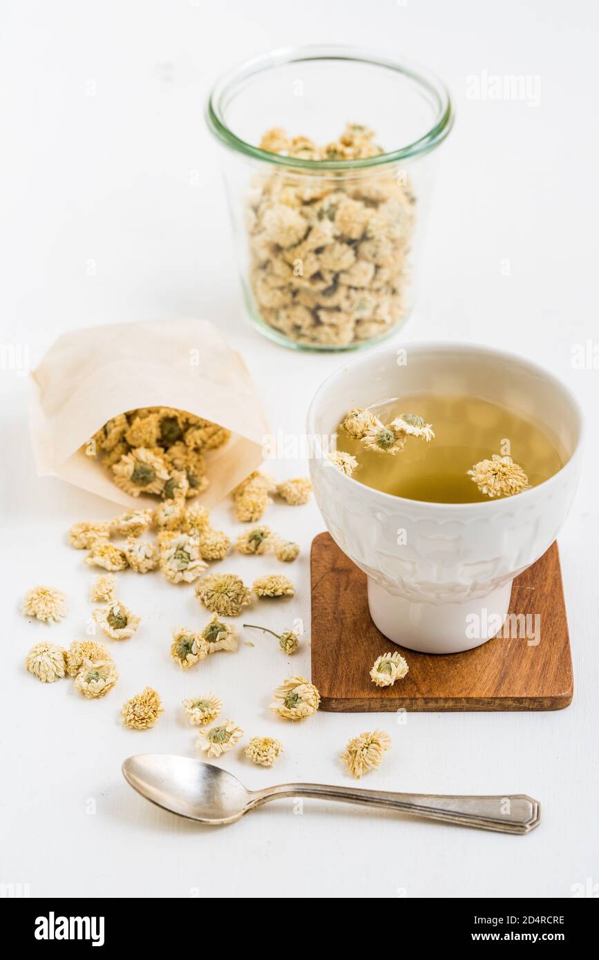 Herbal tea of dry blossoms of camomile (Anthemis nobilis). Stock Photo