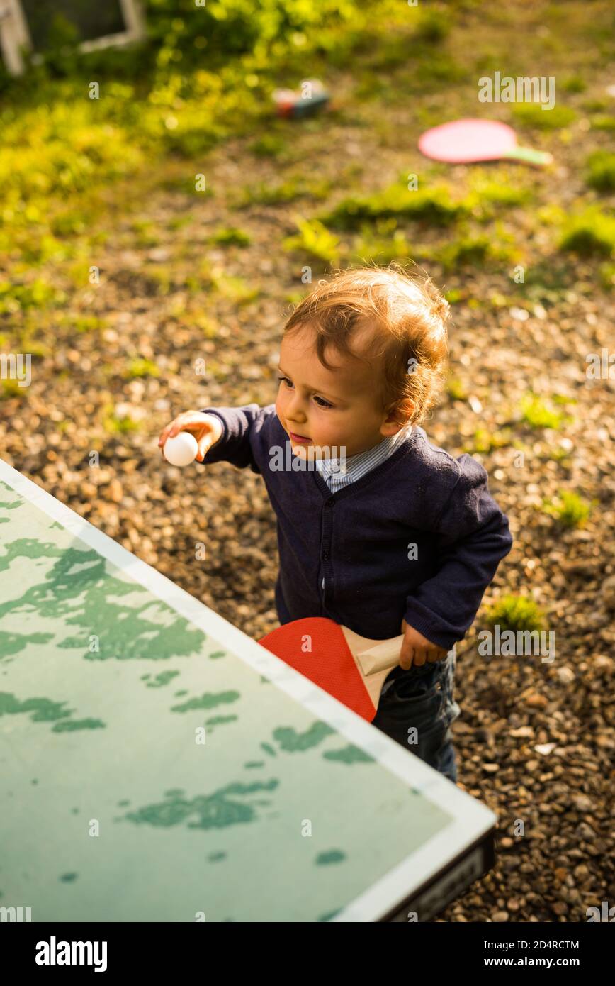 2 year old boy playing ping pong Stock Photo Alamy