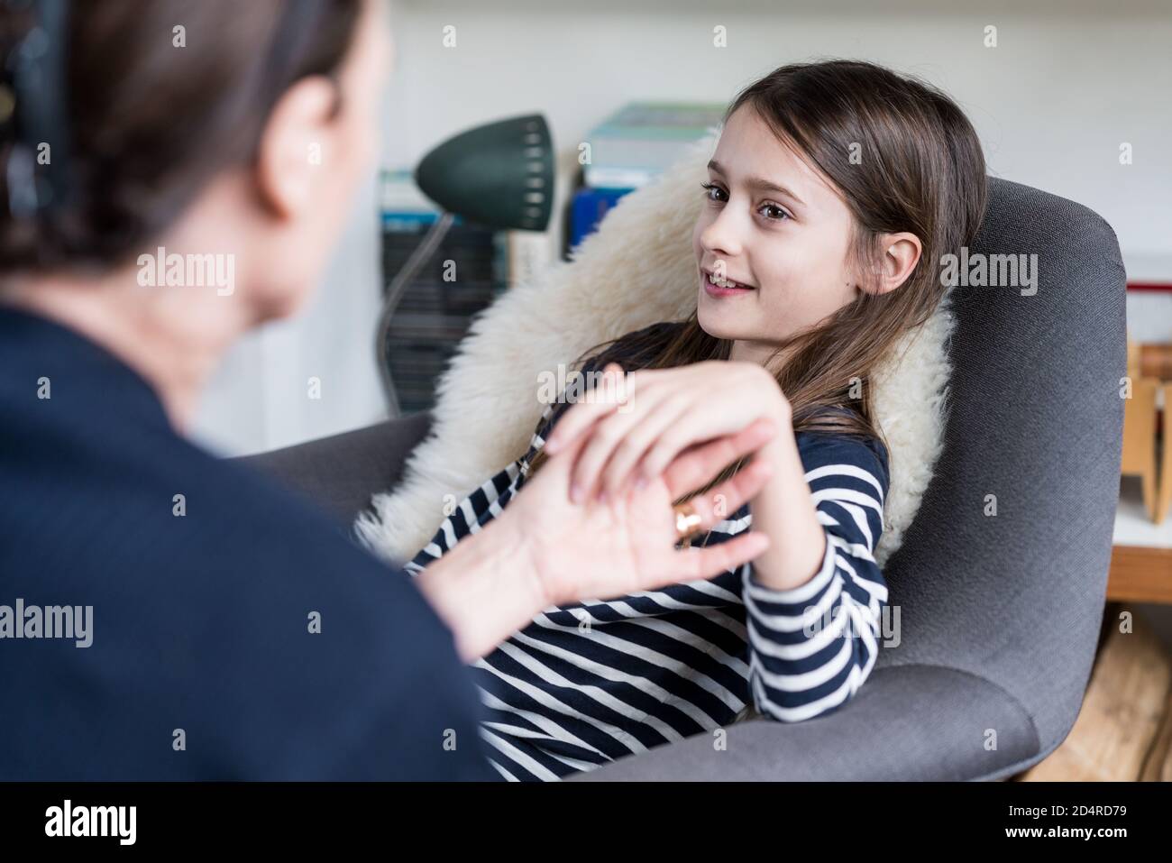 10 years old girl undergoing ericksonian hypnosis. Stock Photo