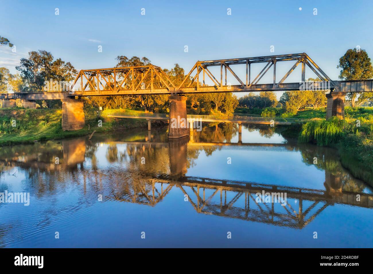 Steel archs of historic railway bridge in Dubbo town of Great Western plains in Australia on Macquarie river. Stock Photo