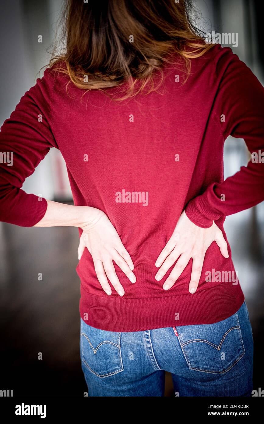 Woman suffering from lumbar pain. Stock Photo