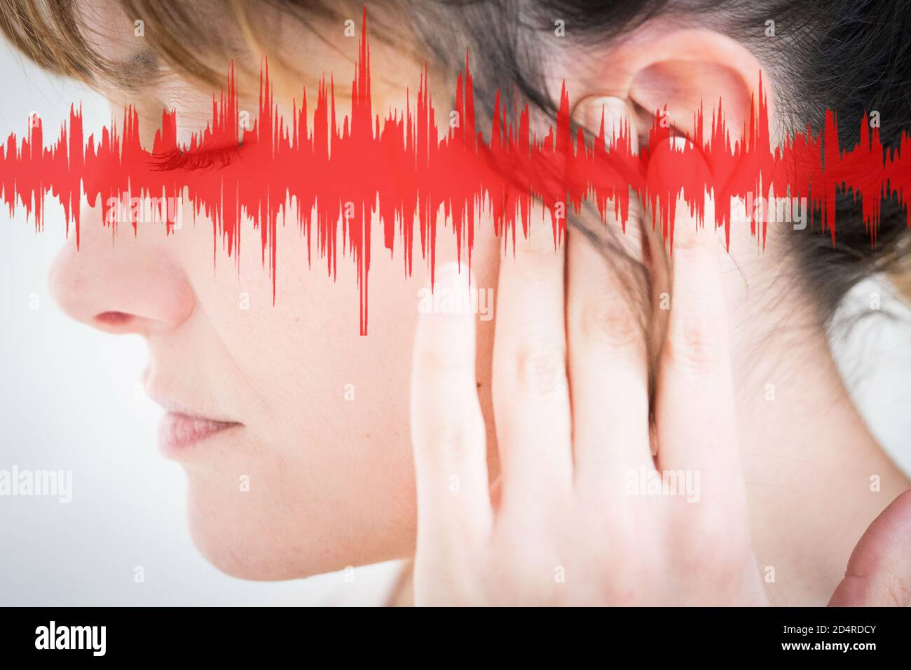 Close-up of the ear of a woman, with graphics representing sound waves. Stock Photo