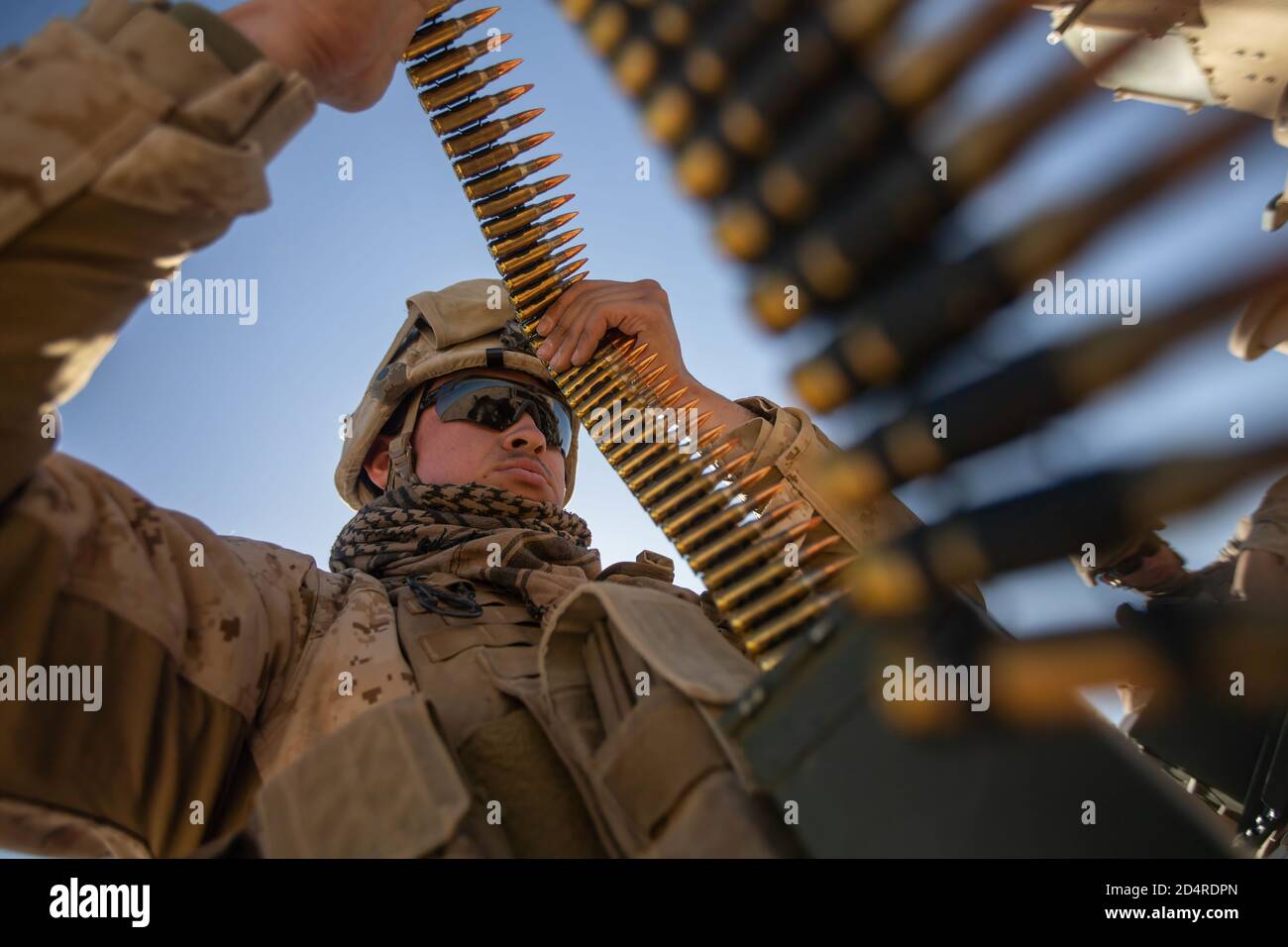 U.S. Marine Corps Lance Cpl. Matthew Martinez with Combat Logistics Battalion 8, Combat Logistics Regiment 2, 2nd Marine Logistics Group, prepares ammunition before a live-fire range during Integrated Training Exercise (ITX) 1-20 at Marine Air Ground Combat Center Twentynine Palms, California, Oct. 29, 2019. CLB-8 integrated with 2nd Marine Regiment during ITX as the logistics combat element to provided tactical logistics in the areas of medium and heavy-lift motor transportation beyond the regiment’s organic capabilities. (U.S. Marine Corps photo by Cpl. Scott Jenkins) Stock Photo