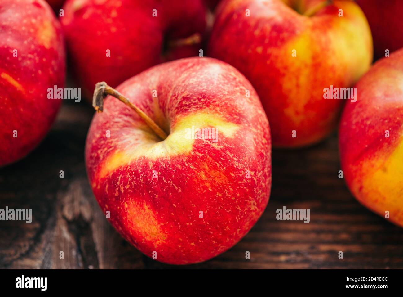 ripe red apple on wooden background horizontal Stock Photo - Alamy
