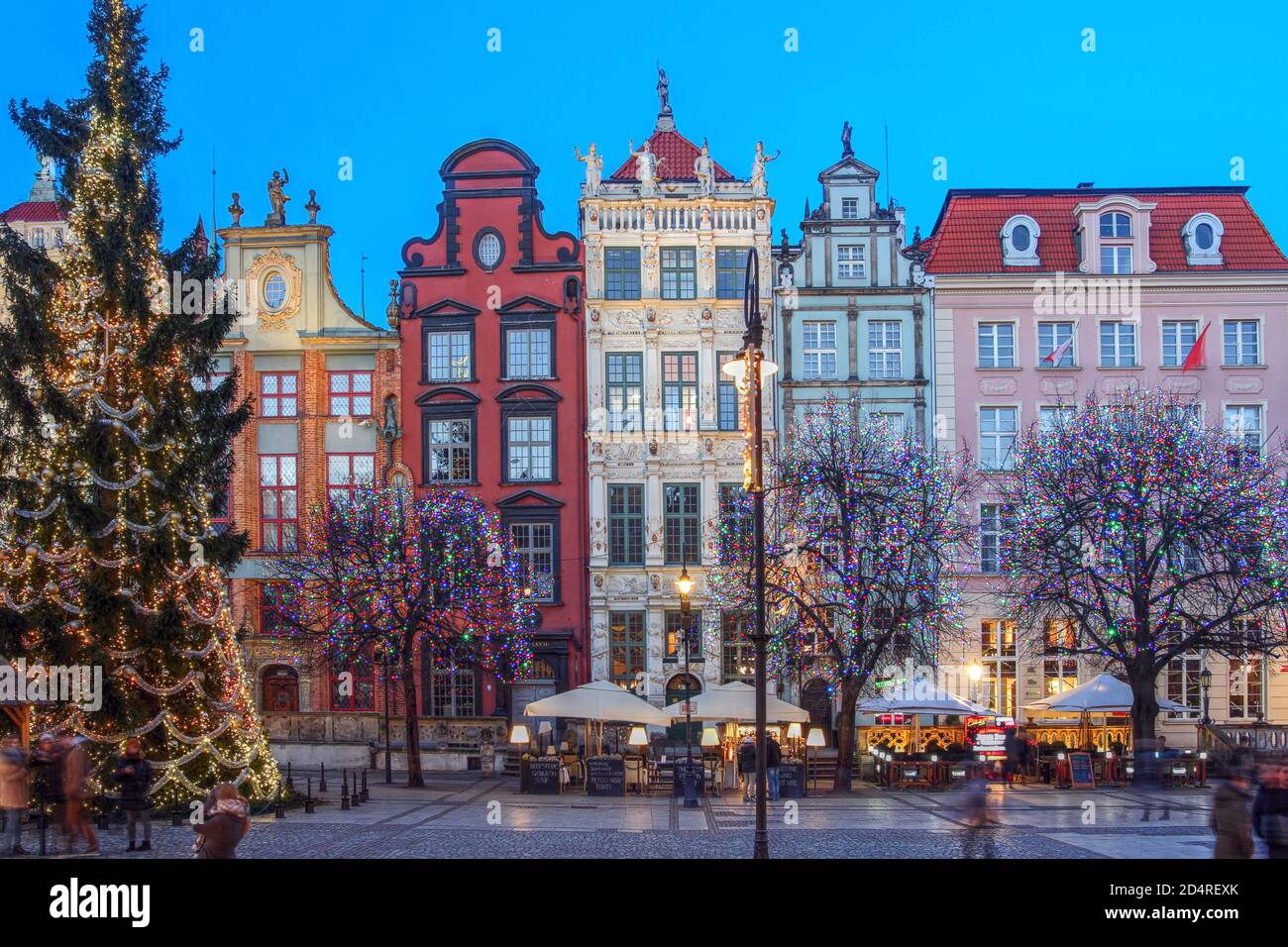 Historic guild houses on Dulga Street in downtown Gdansk, Poland during winter with Christmas decorations. Stock Photo