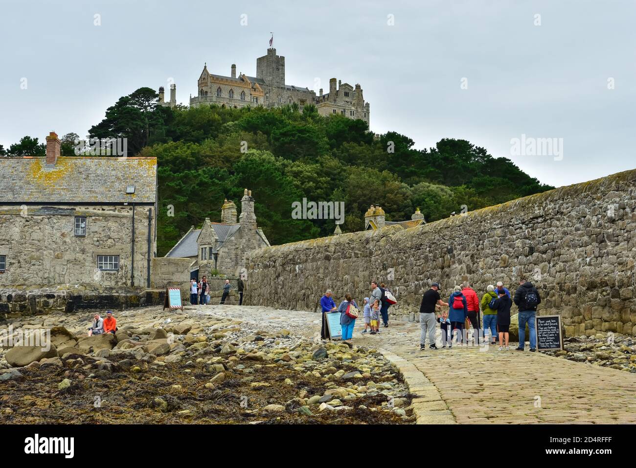 St Michael's Mount in Cornwall connecting to Marazion with a causeway which submerges under the water at high tide Stock Photo