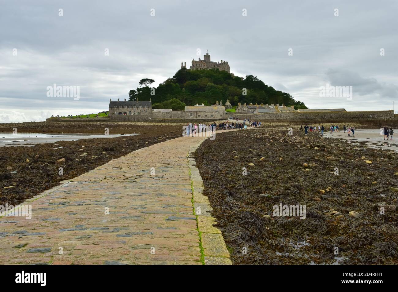 St Michael's Mount in Cornwall connecting to Marazion with a causeway which submerges under the water at high tide Stock Photo