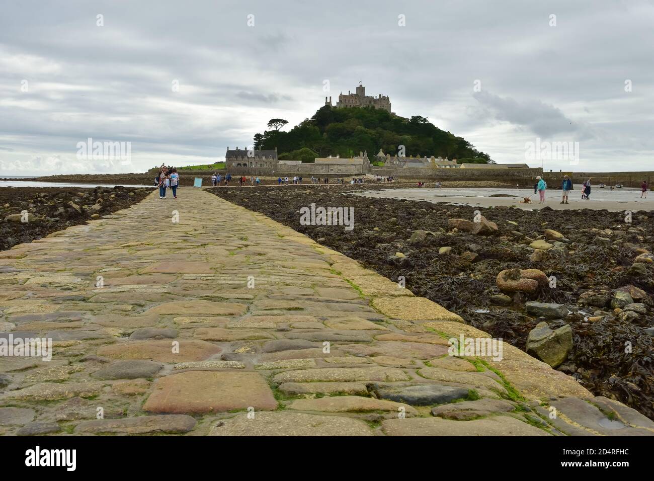 St Michael's Mount in Cornwall connecting to Marazion with a causeway which submerges under the water at high tide Stock Photo