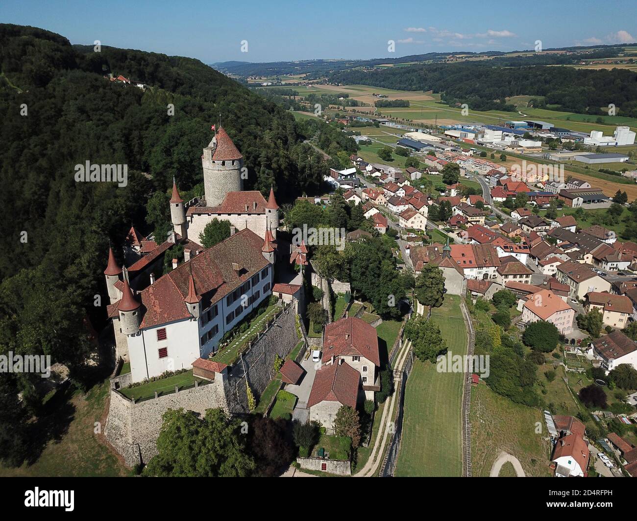 Aerial of Chateau de Lucens looming over the small town bearing the same  name in Canton de Vaud, Switzerland Stock Photo - Alamy