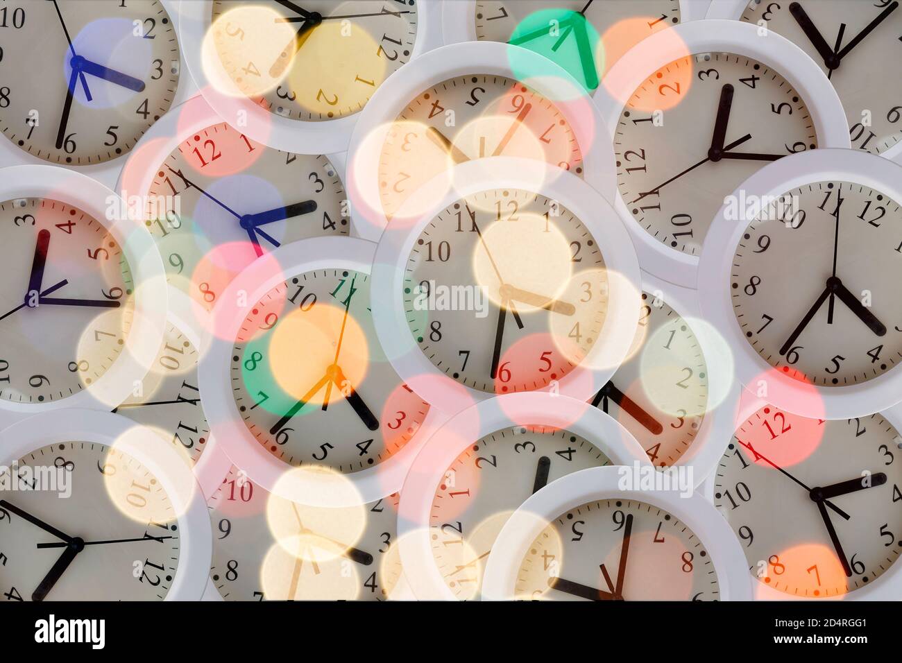 Composition with many clocks with lights, glitters and reflections Stock Photo