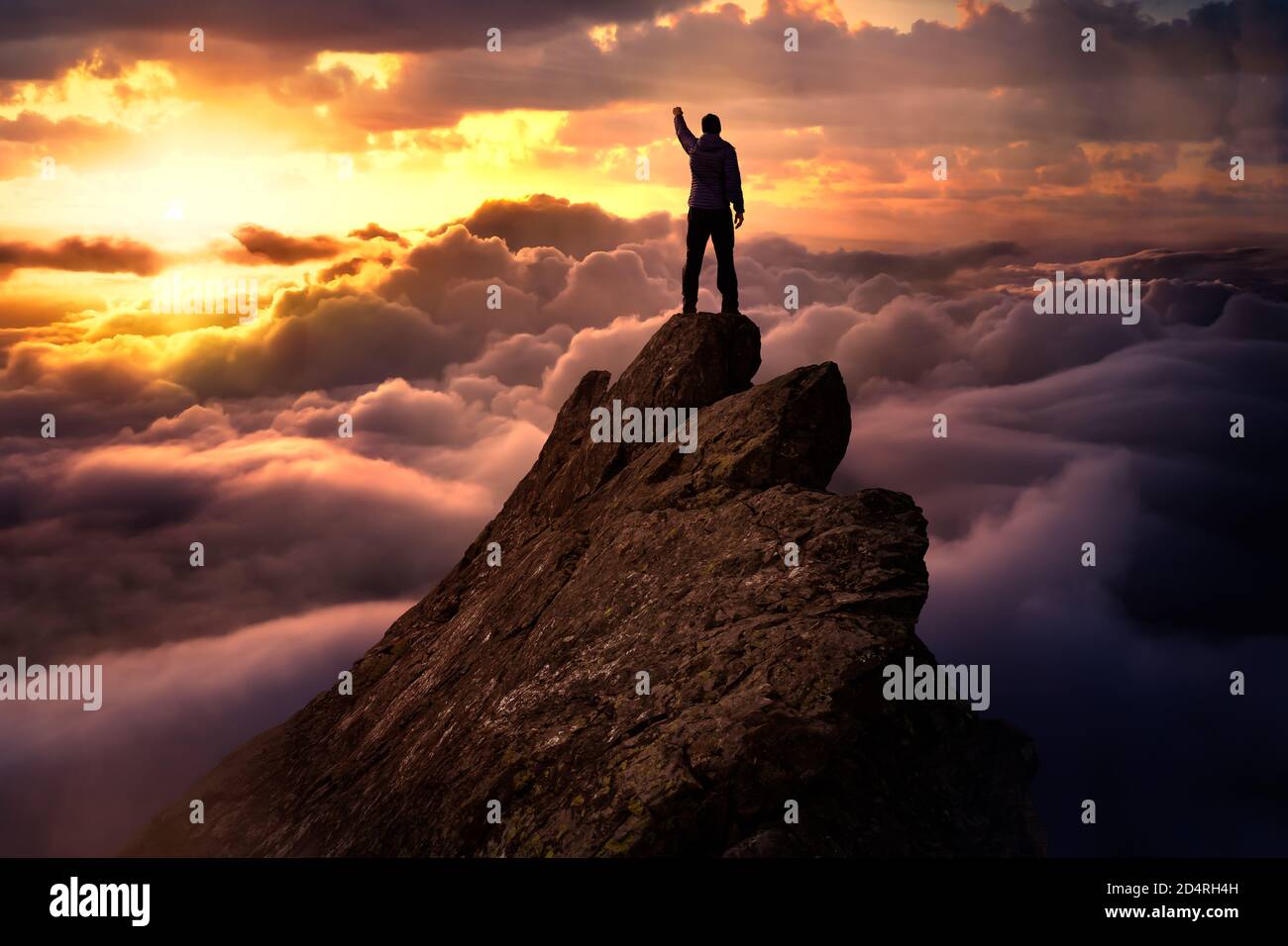 Fantasy Adventure Composite with a Man on top of a Mountain Cliff Stock  Photo - Alamy