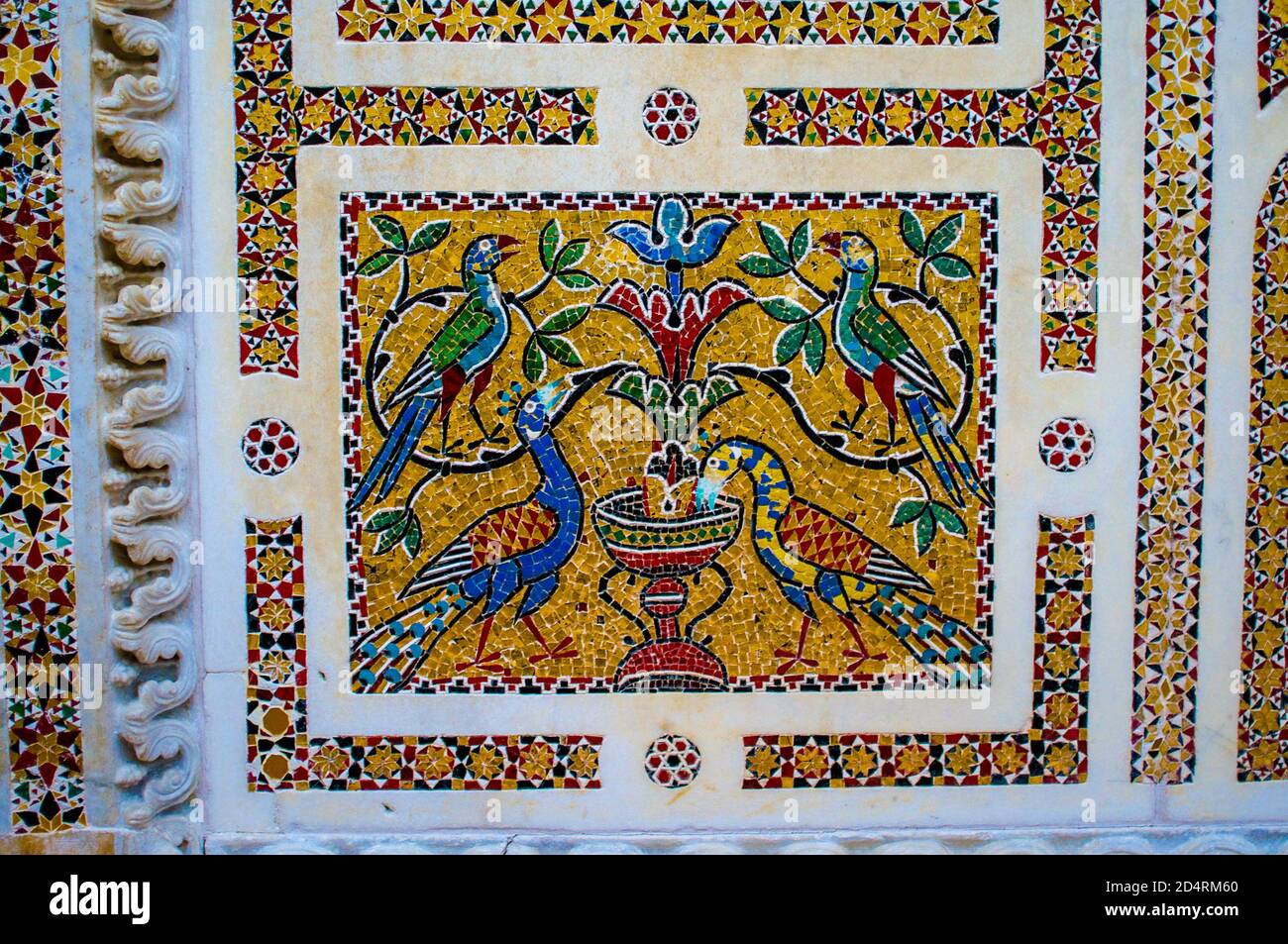 Brightly colored mosaic featuring exotic birds and fountain, on the Ambo of the Epistles (early reading stand) in the Duomo di Ravello, Amalfi Coast. Stock Photo