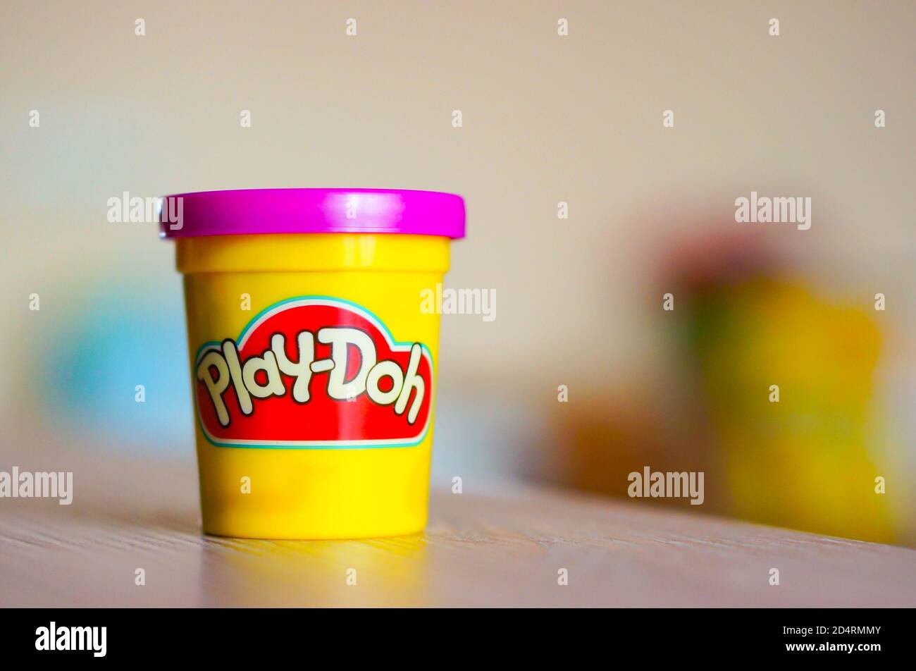 An opened plastic Play Doh container on a table Stock Photo - Alamy