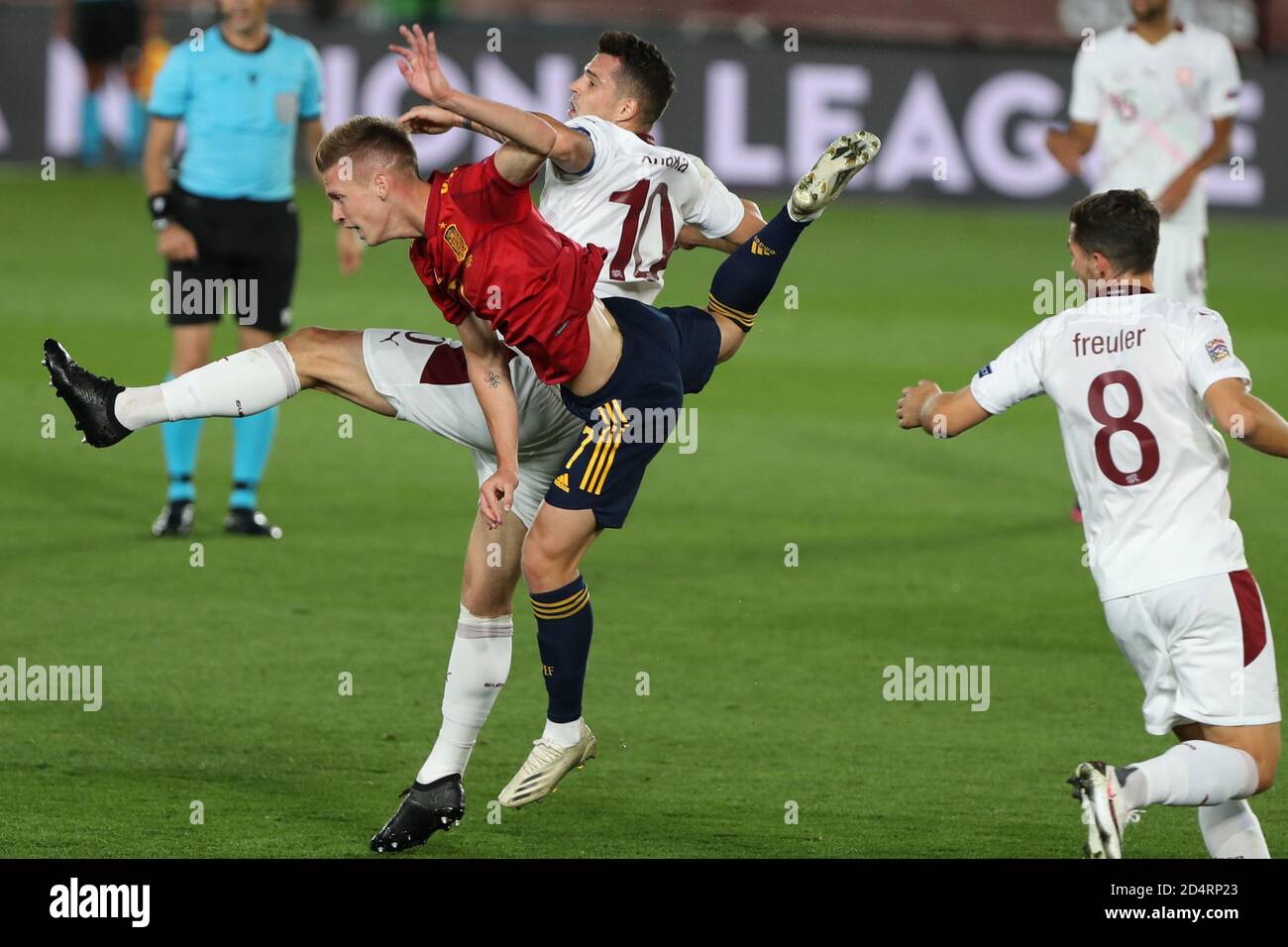 Madrid, Spain. 10th Oct, 2020. Spain's Dani Olmo (front) vies with Switzerland's Granit Xhaka during the UEFA Nations League football group match between Spain and Switzerland in Madrid, Spain, Oct. 10, 2020. Credit: Edward F. Peters/Xinhua/Alamy Live News Stock Photo