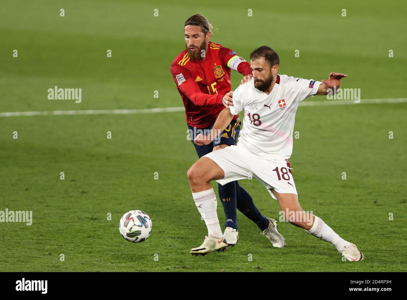 Madrid, Spain. 10th Oct, 2020. Spain's Sergio Ramos (L) vies with Switzerland's Admir Mehmedi during the UEFA Nations League football group match between Spain and Switzerland in Madrid, Spain, Oct. 10, 2020. Credit: Edward F. Peters/Xinhua/Alamy Live News Stock Photo