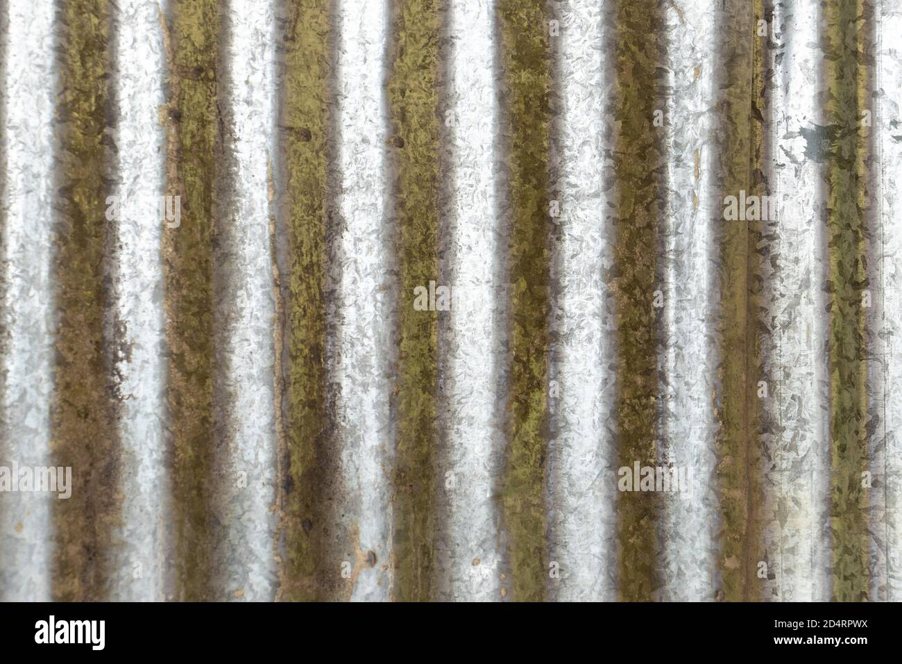 Rusty sheets of corrugated iron in different colors. Texture background of  brown, gray, yellow, green corrugated fence. Colorful galvanized sheet.  Background image of corrugated metal sheets 4542924 Stock Photo at Vecteezy