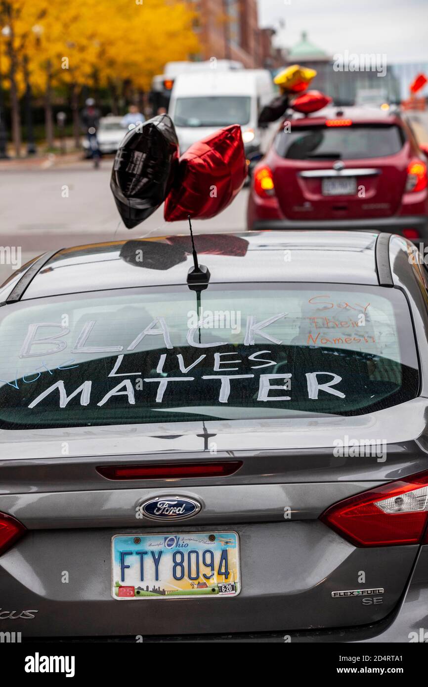 The 'Safely Supporting Black Lives Matter Car Parade' moves through downtown Columbus. Desmond Fernandez in association with Worthington Racial Justice Organizing, 8 Minutes and 46 Seconds to Justice and Cheryl Best, a 72 year old activist, put together 'Safely Supporting Black Lives Matter Car Parade'. The BLM (Black Lives Matter) Car Parade met in the parking lot of Broad St. Presbyterian Church where they decorated their cars with BLM words, names of people killed in by the justice system and balloons to indicate parade participants. Best said, '.I couldn't participate in the protests bec Stock Photo