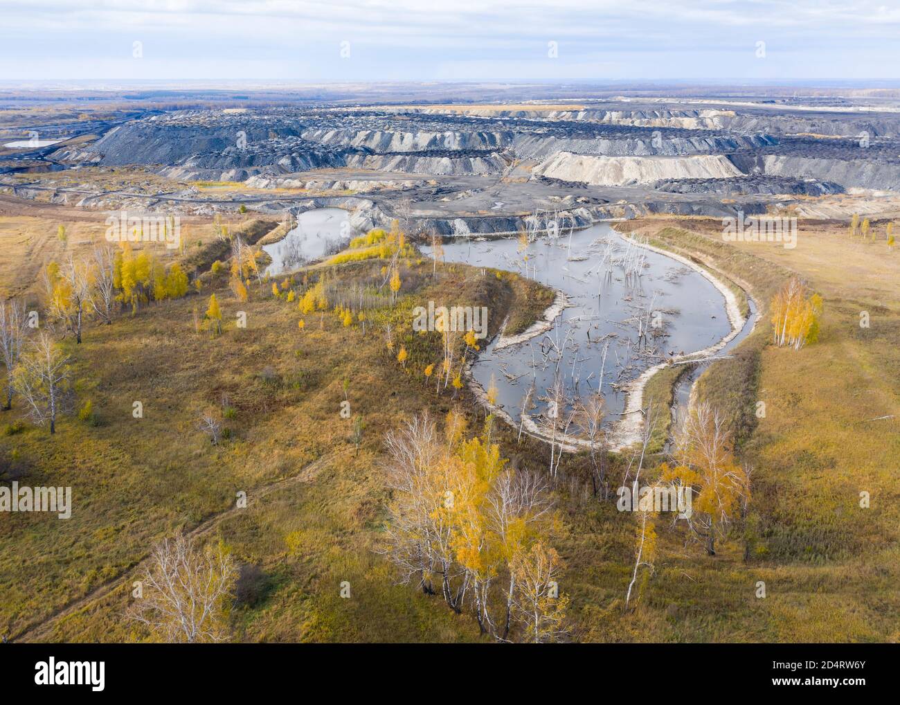 An arial view of a coal opencast mine impending on the wildlife of the Siberian forest in Russia Stock Photo