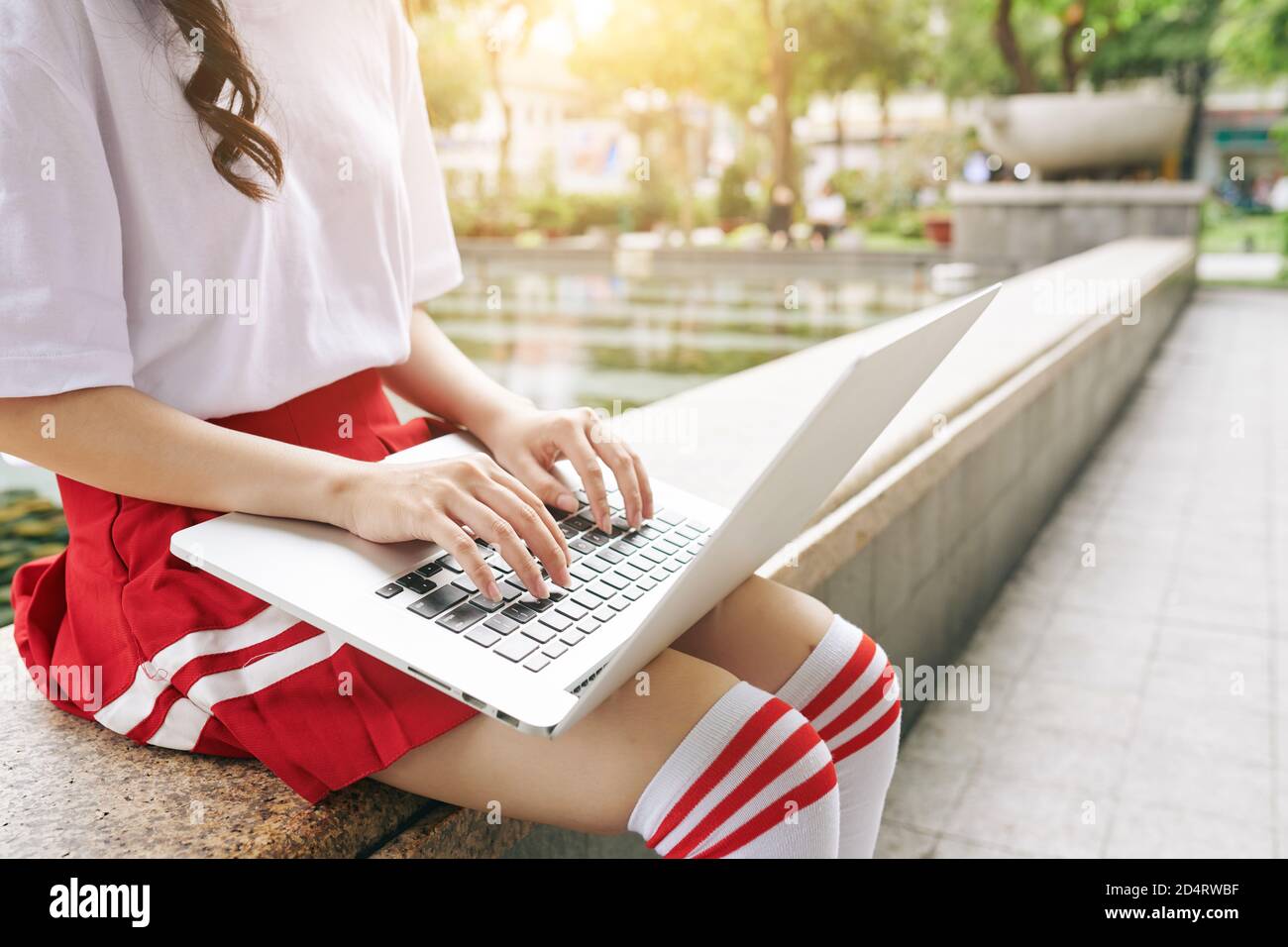 Korean schoolgirl working on laptop Stock Photo - Alamy