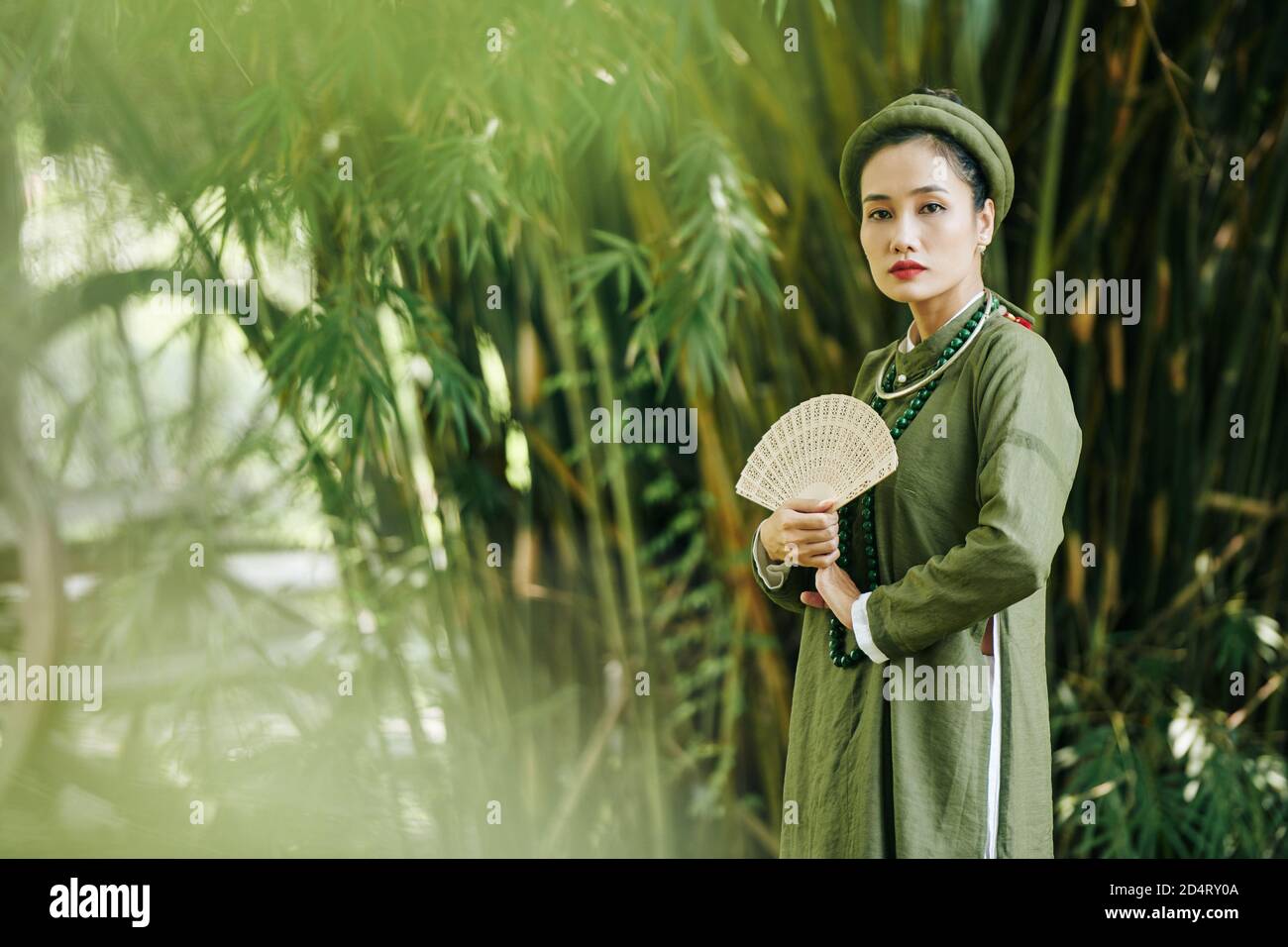 Serious woman in Vietnamese costume Stock Photo Alamy