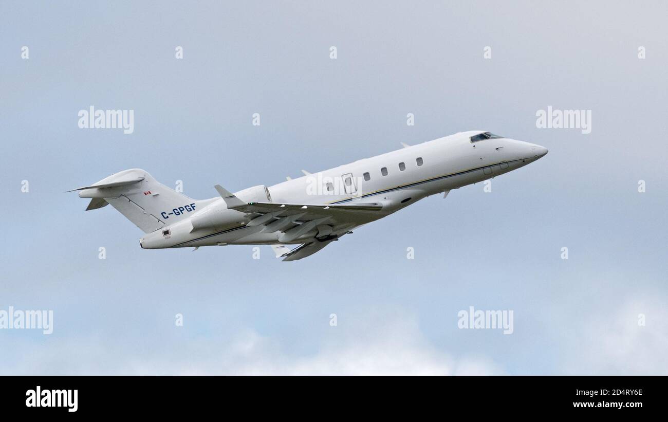 Richmond, British Columbia, Canada. 9th July, 2020. A Bombardier BD-100-1A10 Challenger 300 business jet (C-GPGF), registered to Sunwest Aviation Ltd., airborne after take-off from Vancouver International Airport. Credit: Bayne Stanley/ZUMA Wire/Alamy Live News Stock Photo
