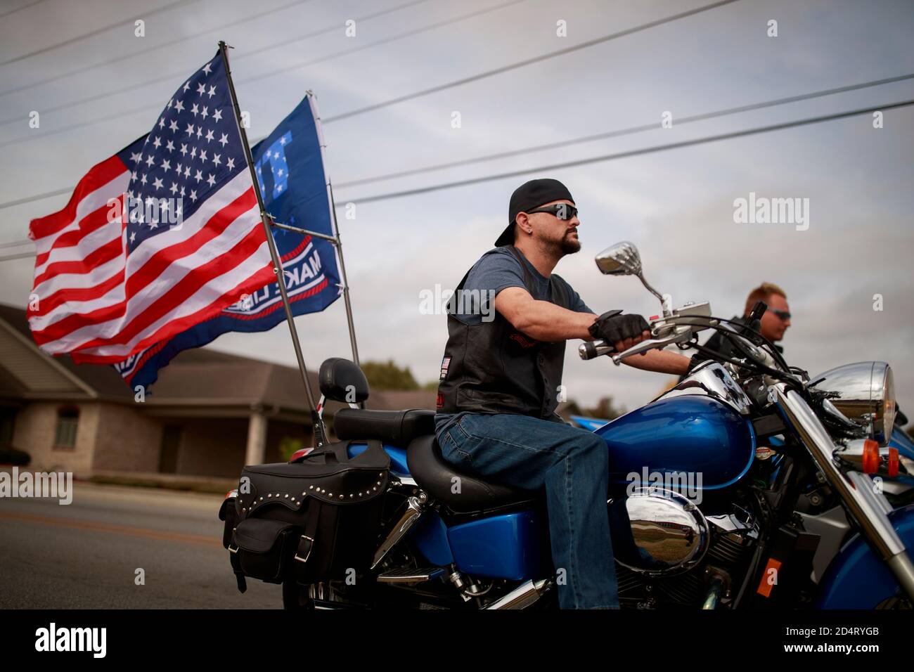 Martinsville, United States. 10th Oct, 2020. Trump supporters riding a  motorcycle participate in a Donald J. Trump parade.Trump is campaigning for  a second term as United States President while running against Democrat