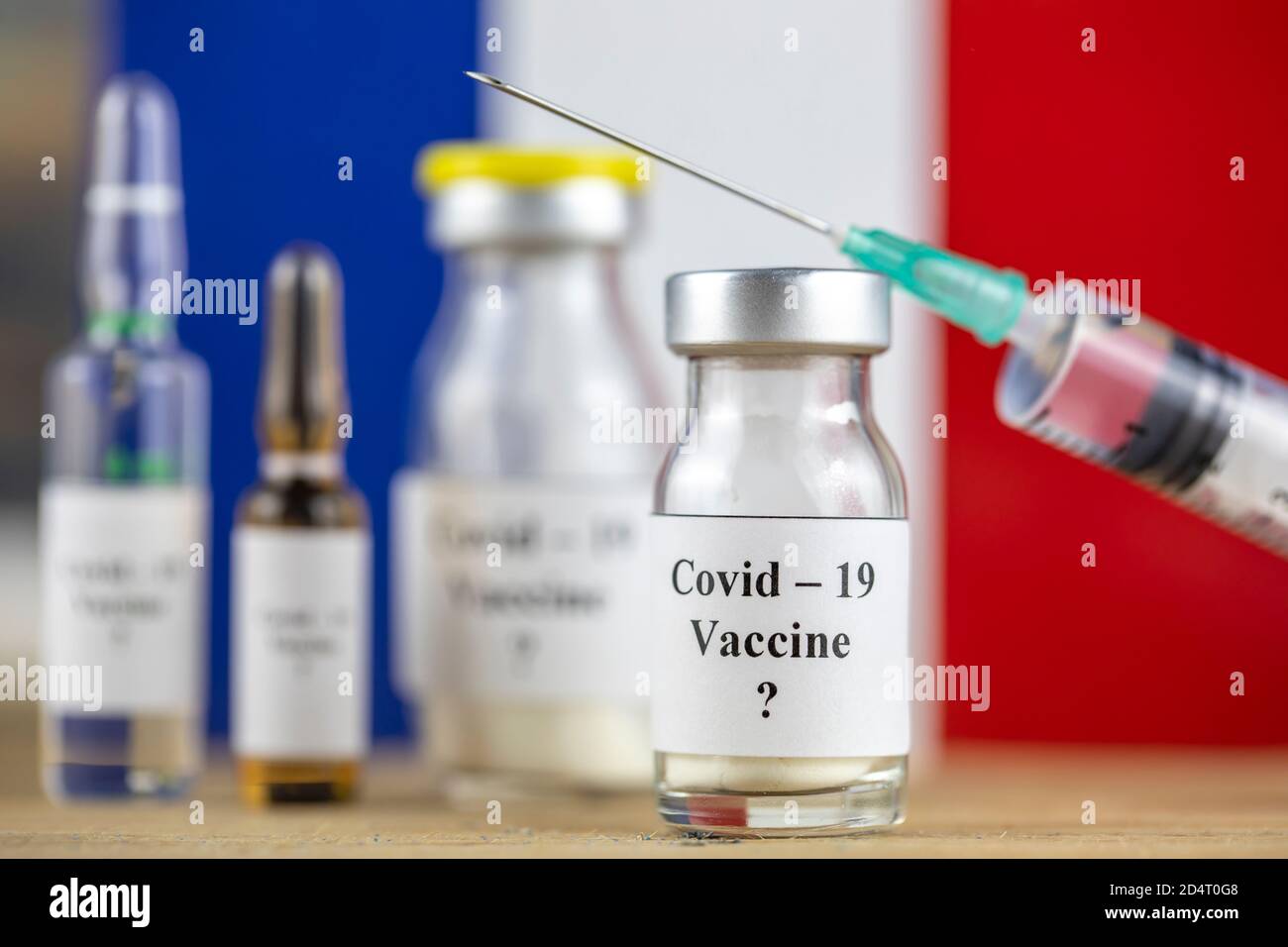 France Flag and bottle with vaccine and syringe, Coronavirus, Covid-19, Medicine, science and healthcare concept Stock Photo