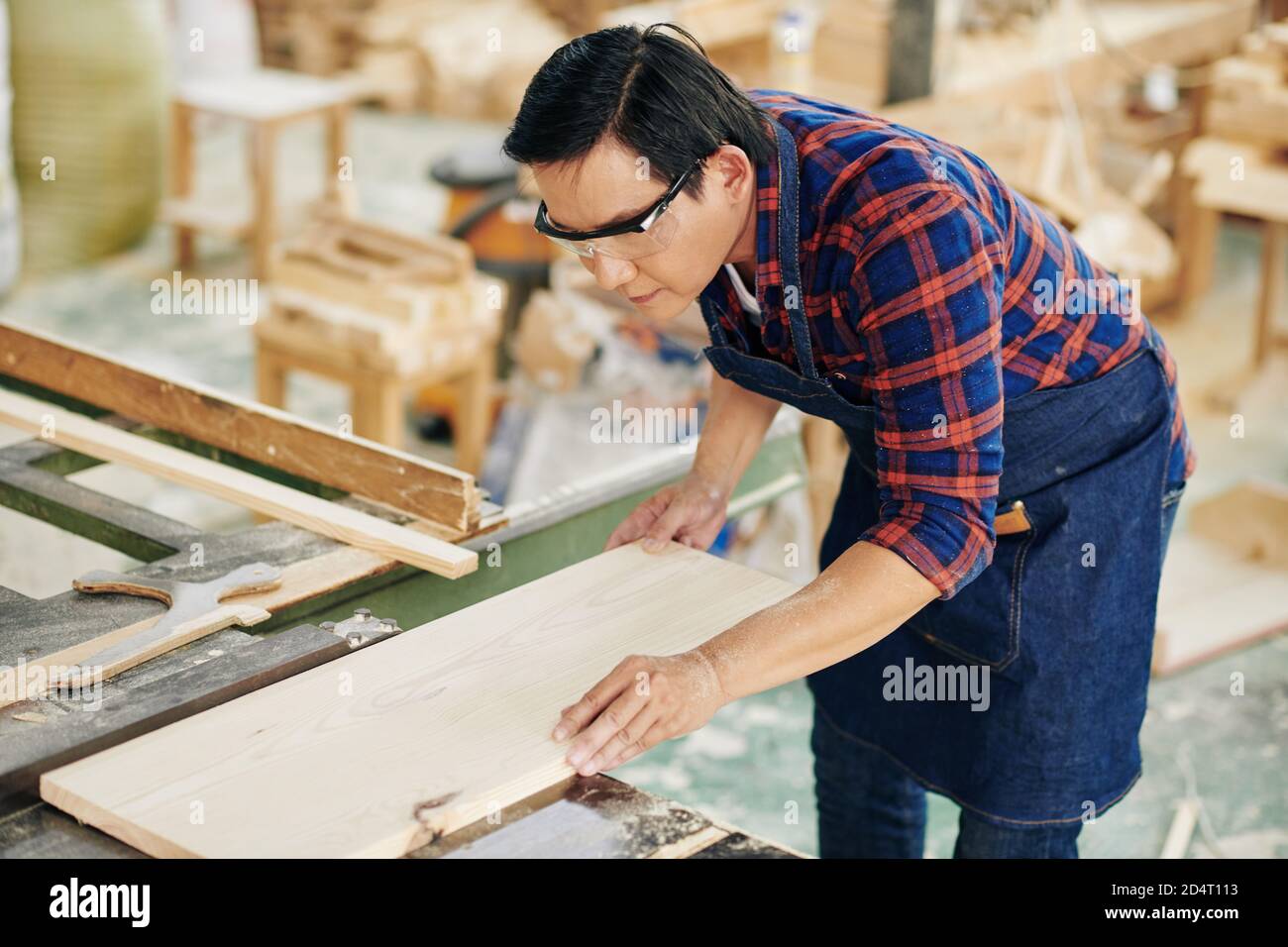 Carpenter making furniture Stock Photo Alamy