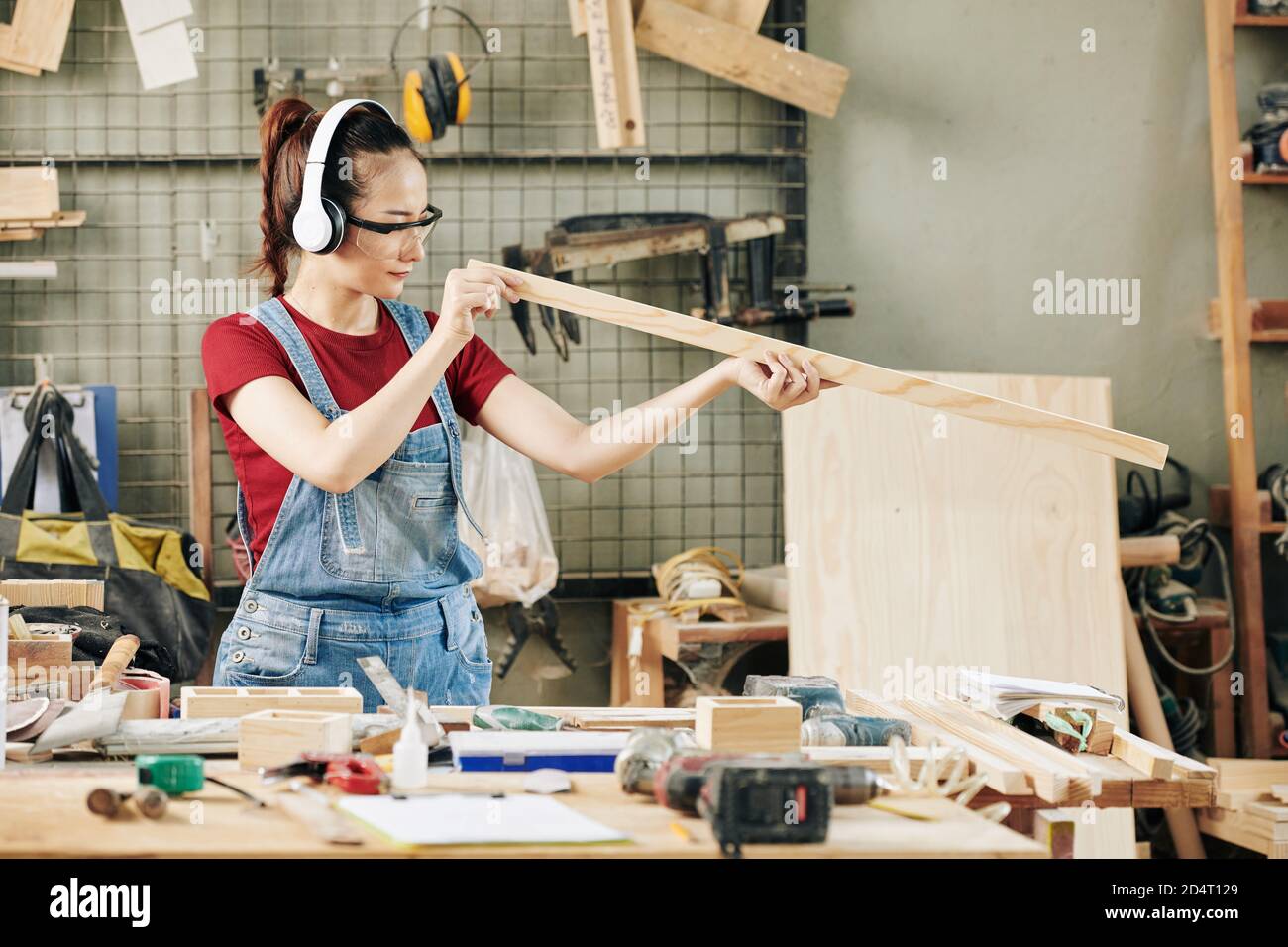Checking plank evenness Stock Photo
