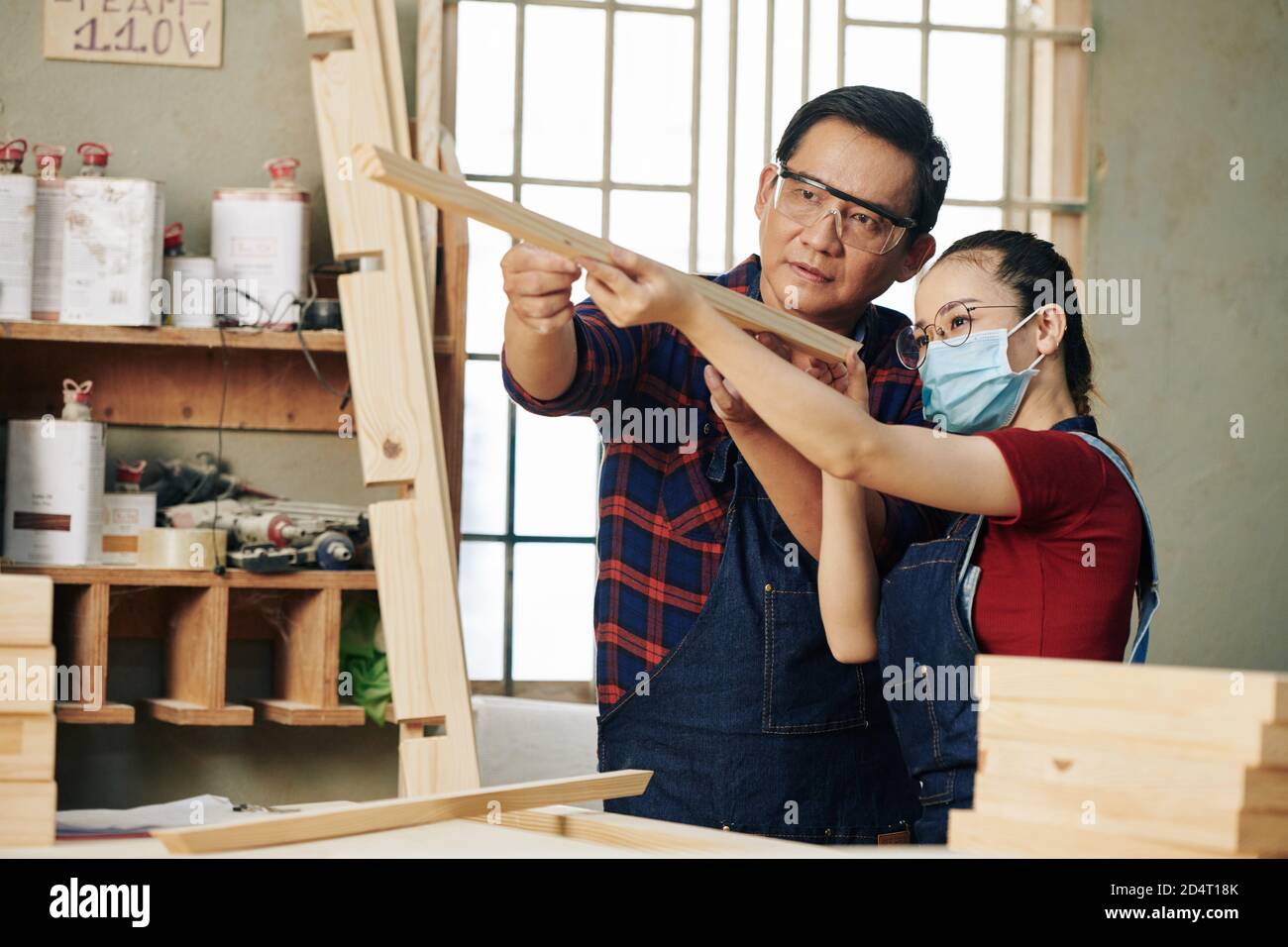 Checking plank evenness Stock Photo