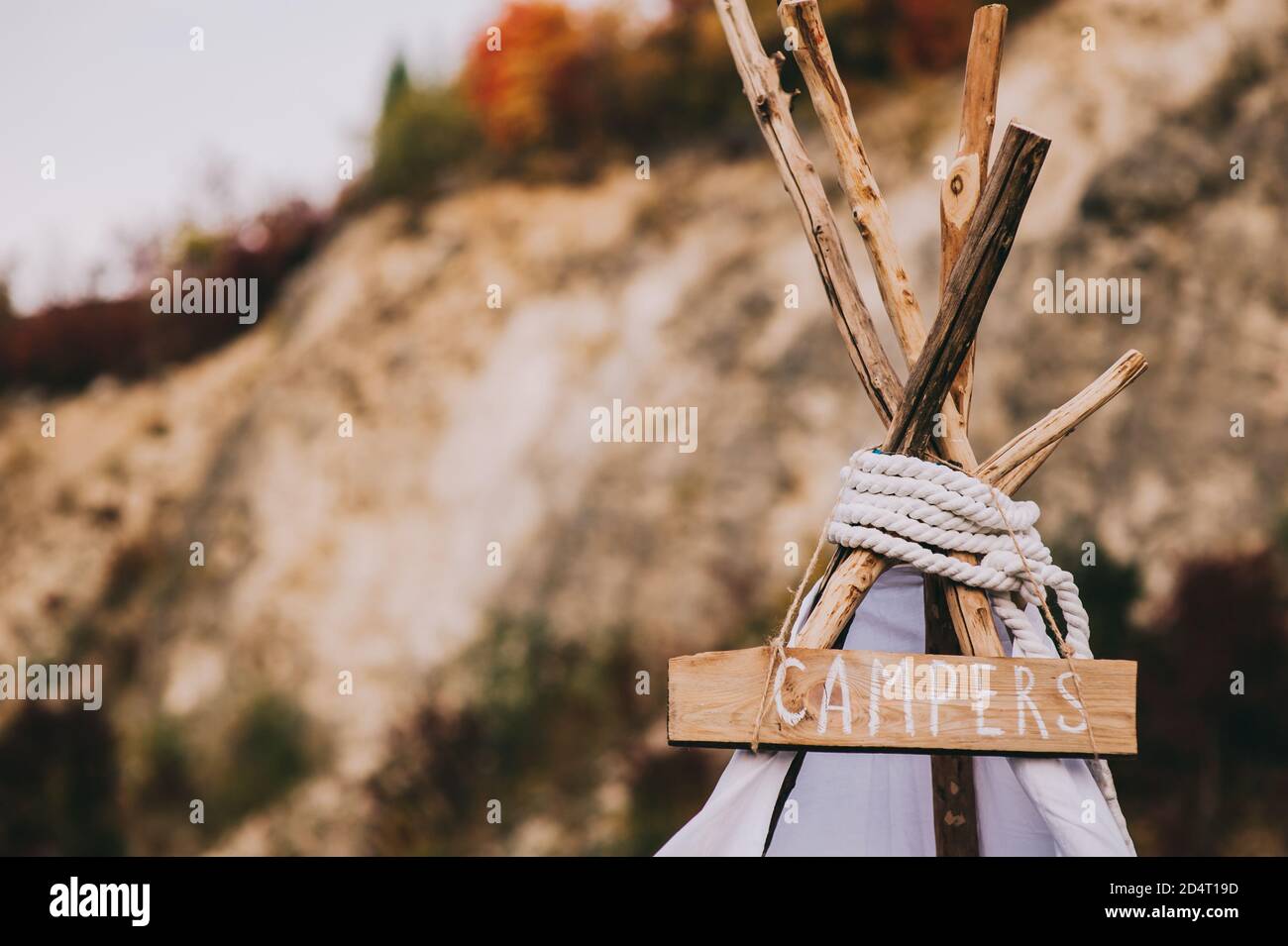 Close up of the top of a house with a wigwam or tent-type with the inscription on the board campers. Stock Photo