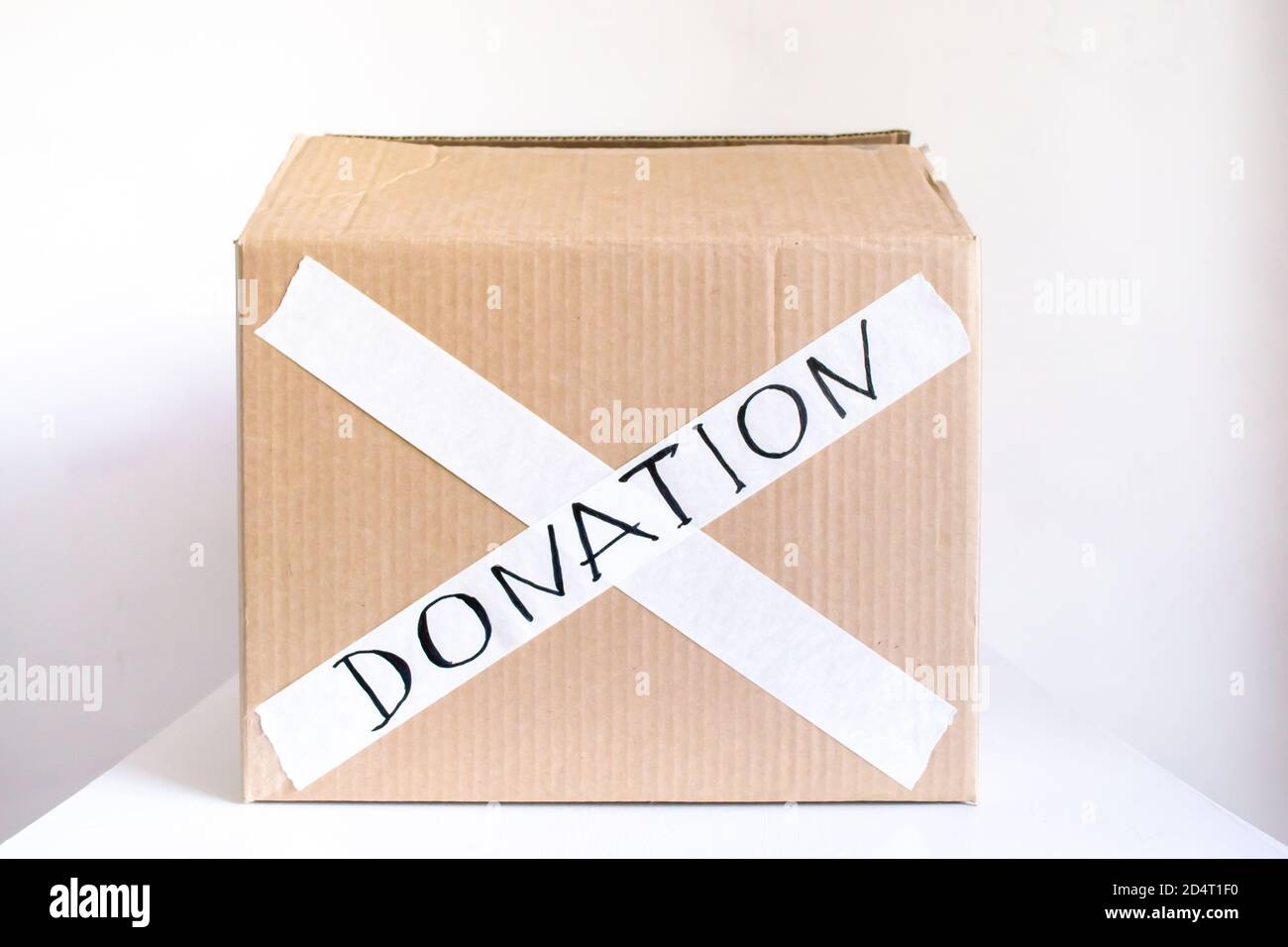 Donation box on a white background. Charity help during the crisis.  Donations of food, clothes, things, toys. Coronavirus quarantine Stock  Photo - Alamy