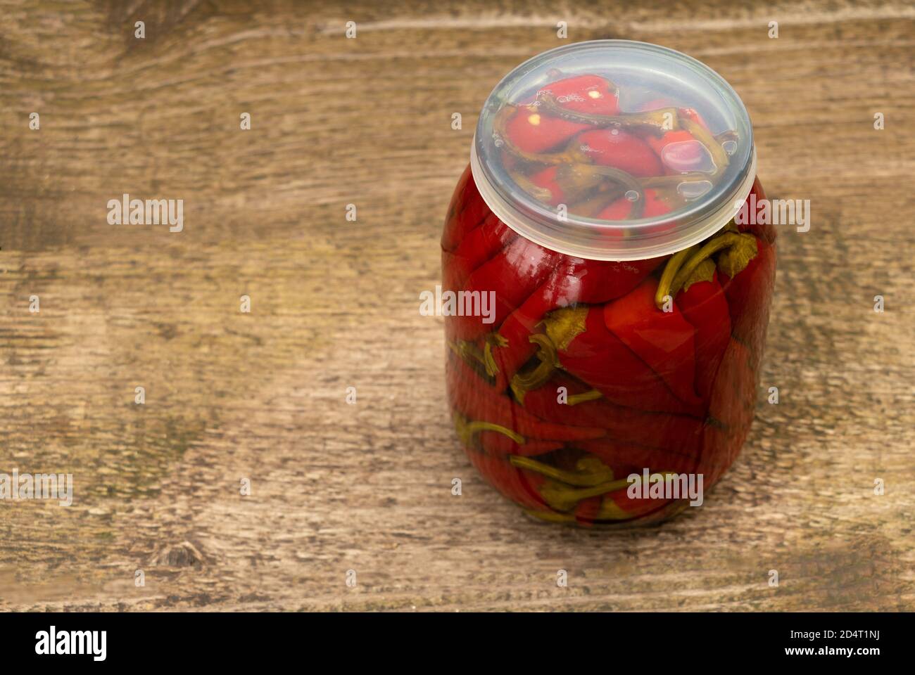 Red and hot peppers preserved in vinegar Stock Photo Alamy