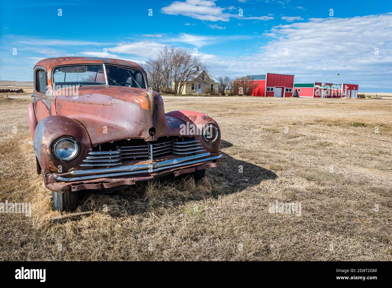 Abandoned vintage car and buildings in a ghost town in Saskatchewan