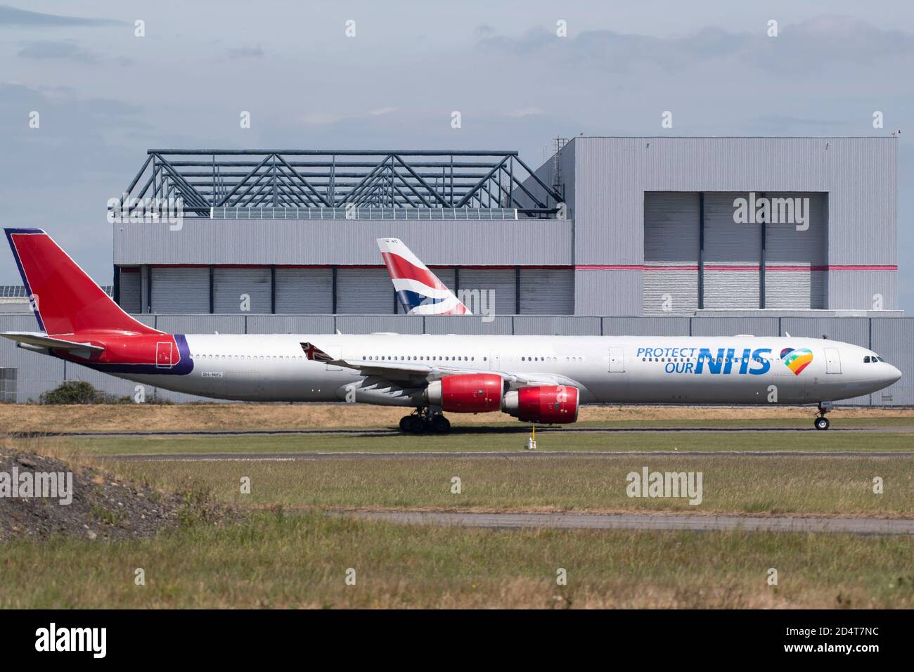 An Airbus A340-600 aircraft with ‘Protect our NHS’ branding takes off from Cardiff Airport on May 26, 2020 in Cardiff, United Kingdom Stock Photo