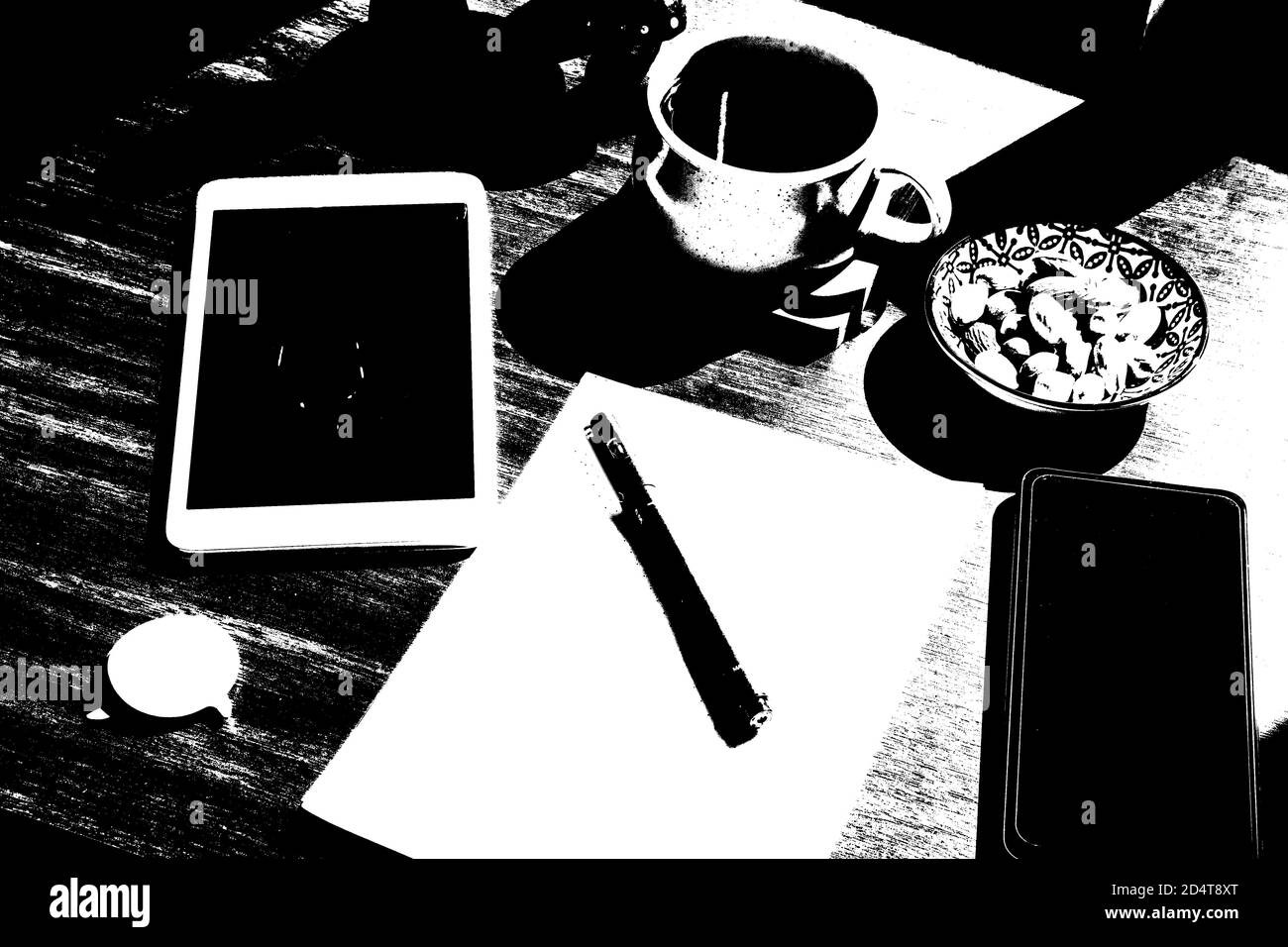 Working from home, workspace with notebook and laptop, coffee and plants, workplace. Paper and pen. Stock Photo