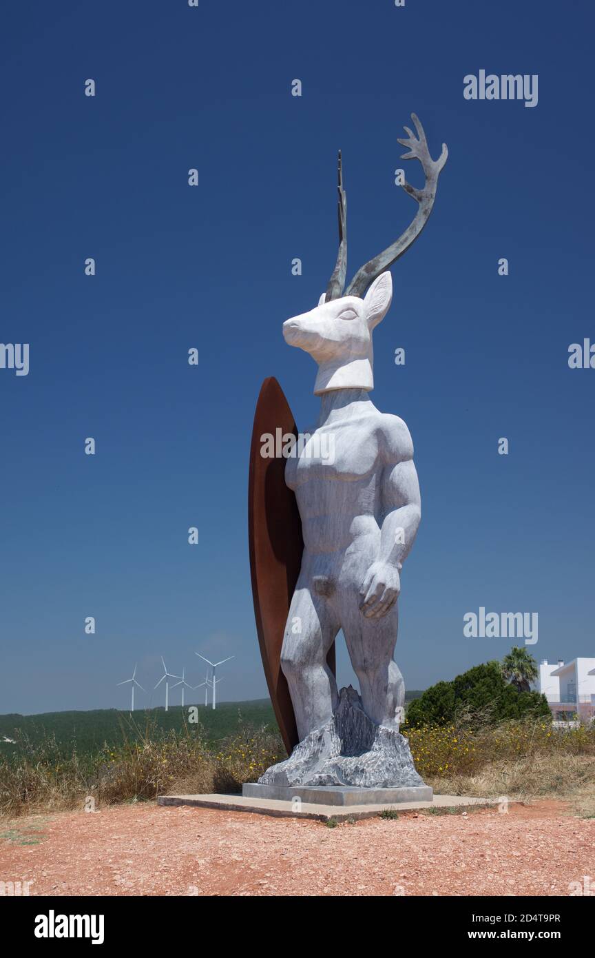 Alberto Adalia statue of surfer with deer's head, Nazare, Portugal Stock Photo