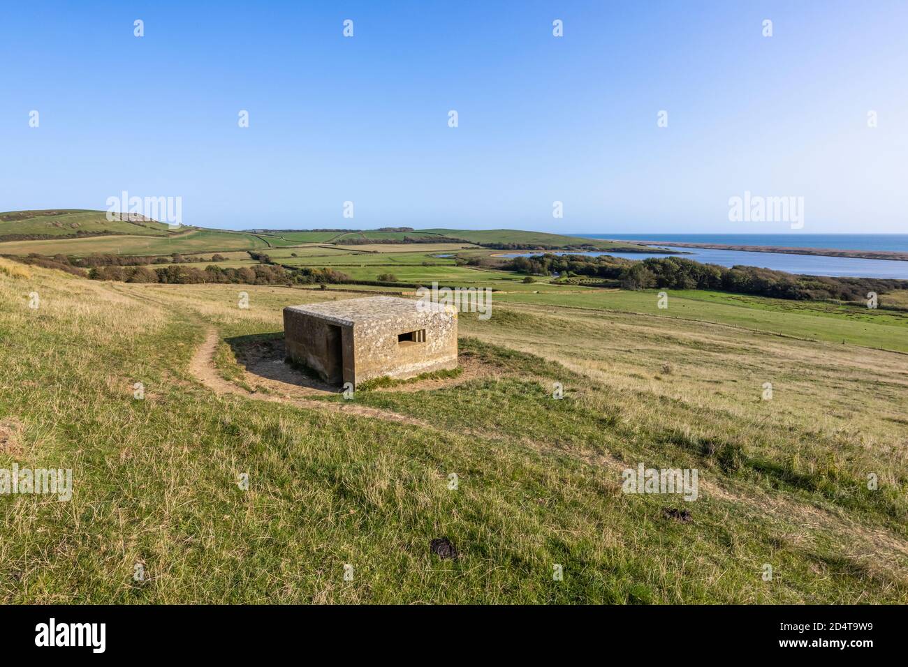 Clifftop pillbox, part of the Second World War coastal defences on the South-West Coast Path near Abbotsbury overlooking Chesil Beach, Dorset, UK Stock Photo