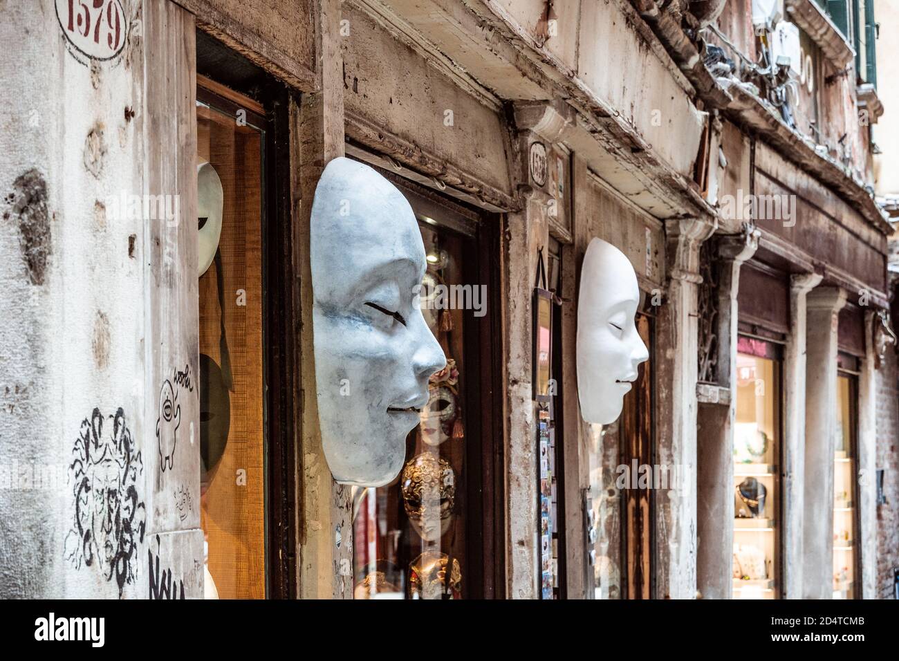 White masks hanging in front of touristic shop in Venice Stock