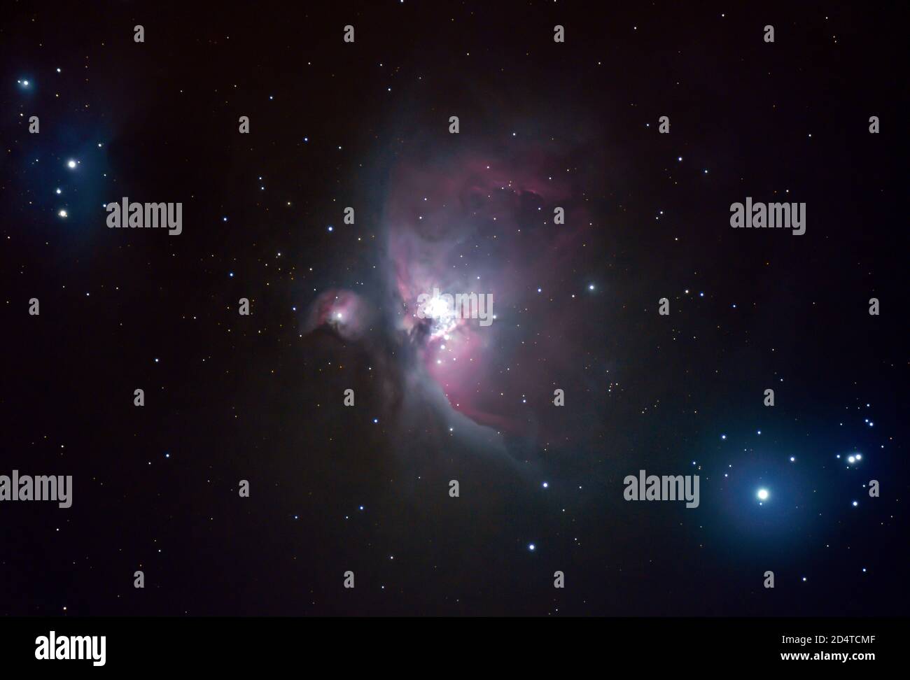 The Orion Nebula, M42, a diffuse nebula photographed from London, UK, 10 October 2020 with multiple long exposures with standard Nikon Z7 camera and 5' refracting telescope. Also visible is M43 to left of main nebula and (top left) NGC 1977, The Running Man Nebula. The blue star lower right is double star Nair al Saif. The Orion Nebula is approx 1,600 light years from planet Earth. Credit: Malcolm Park/Alamy. Stock Photo
