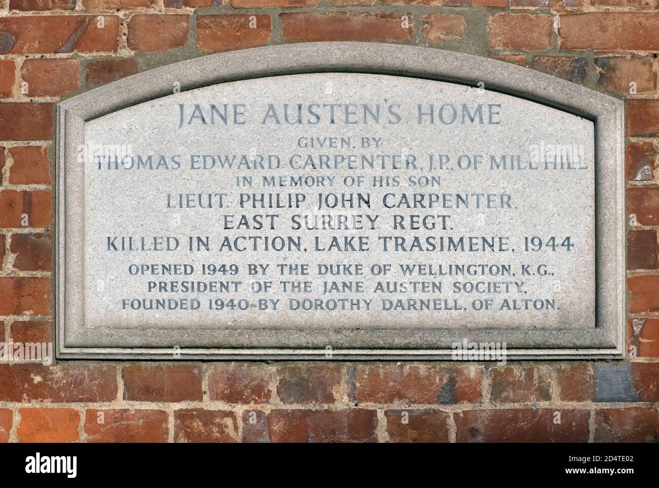 Plaque on the side of Jane Austen's Home at Chawton in memory of Lieut Philip John Carpenter killed in action 1944, Chawton, Hampshire, England, UK Stock Photo
