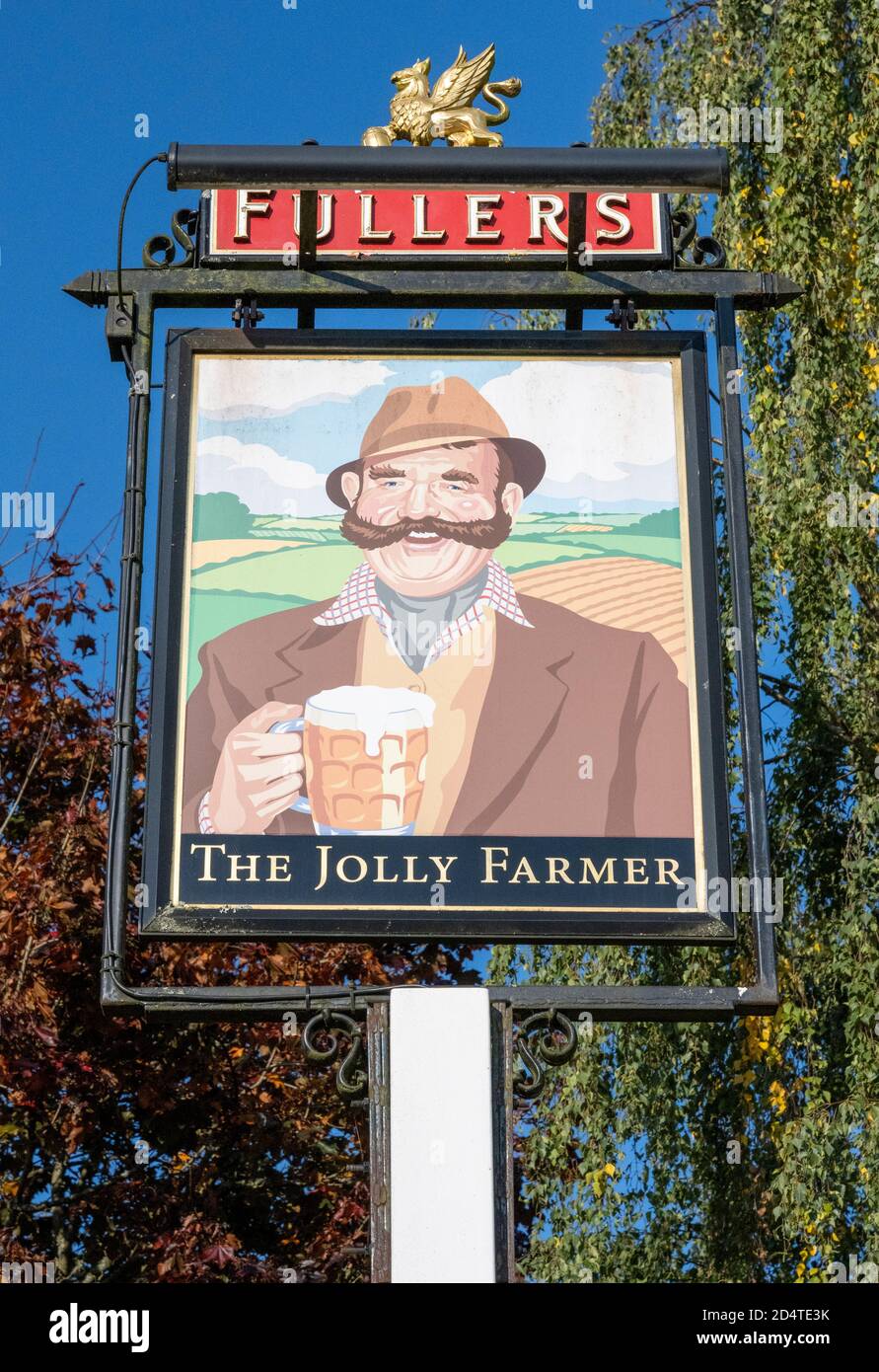 Traditional hanging pub sign at The Jolly Farmer a Fullers Pub and Restaurant, Blacknest, Alton, Hampshire, England, UK Stock Photo