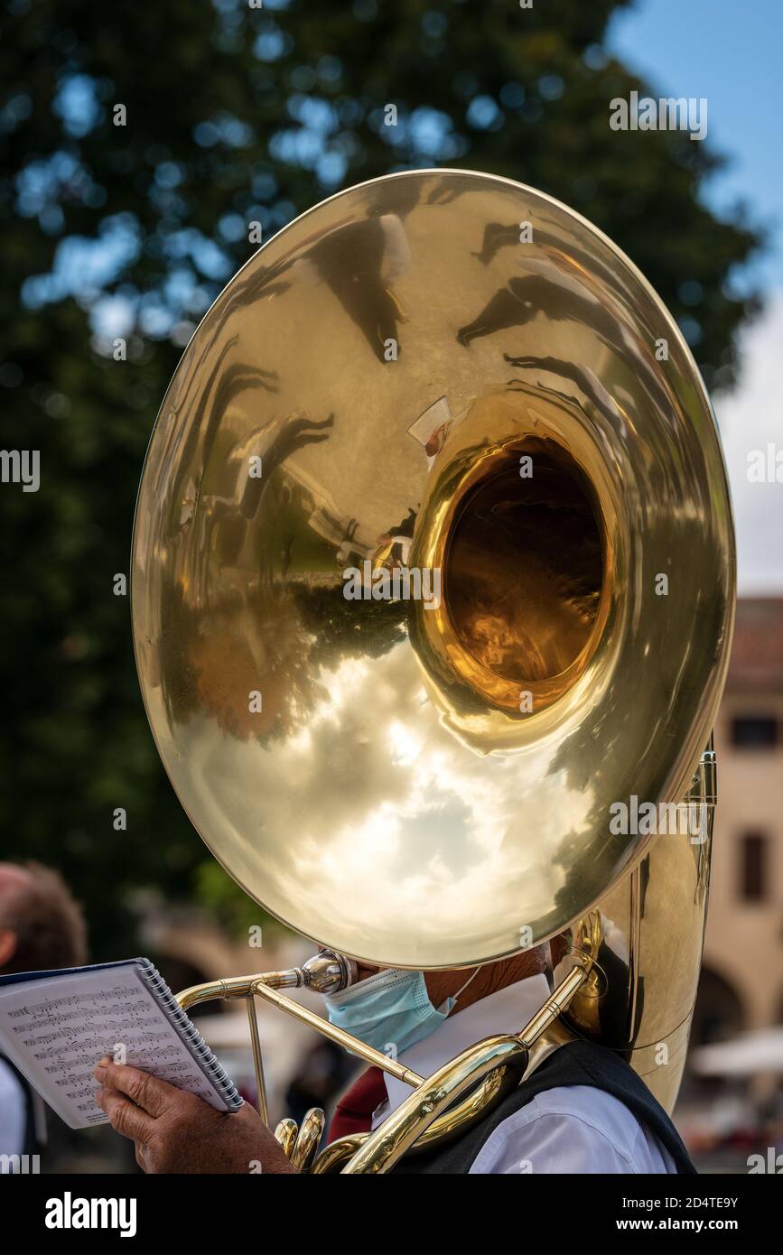 Close-up of a musician of a brass band playing the Tuba Sousaphone during a city festival in the center of Padua, Veneto, Italy, Europe. Stock Photo