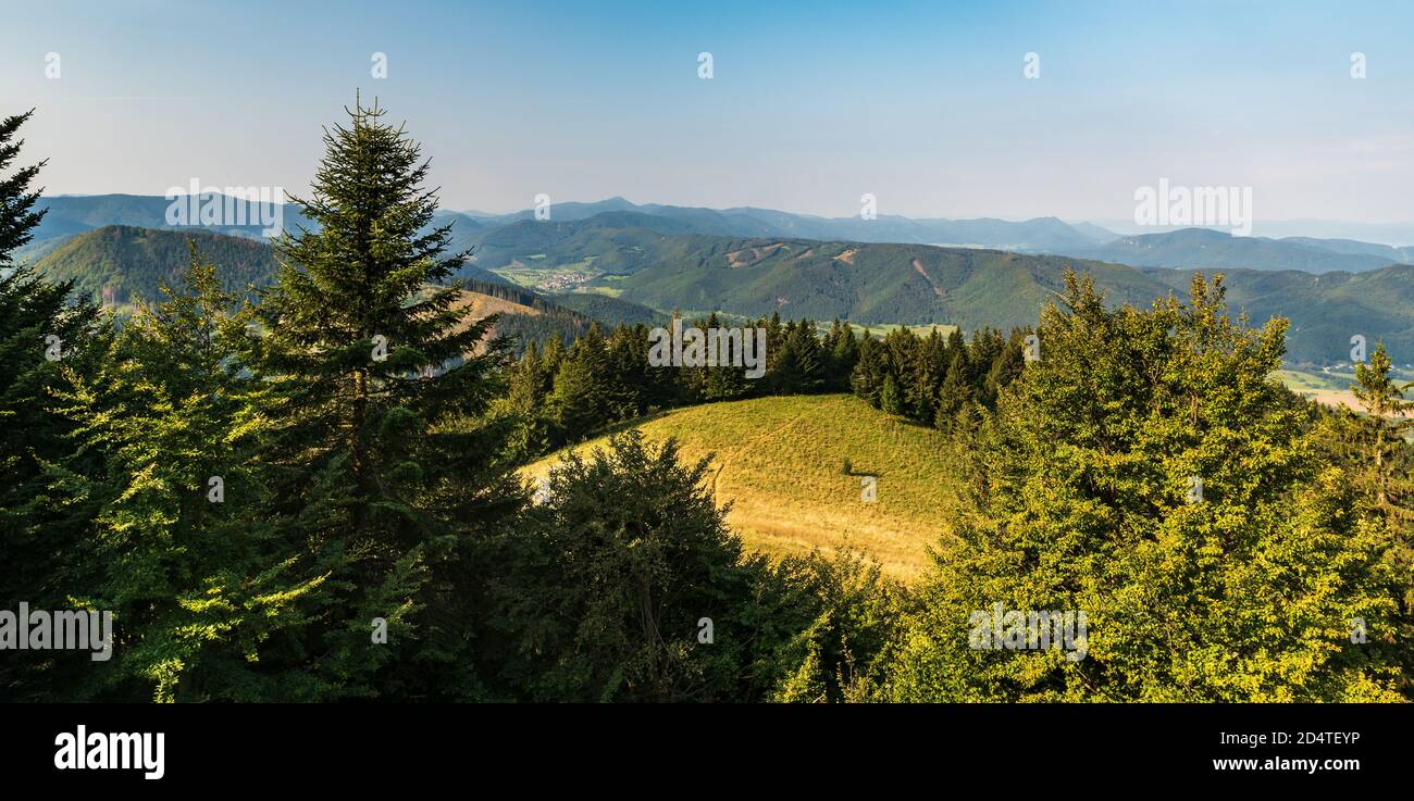 View from Baba hill above Durcina village in Lucanska Mala Fatra mountains in Slovakia with Fackov village, meadows and hills of Strazovske vrchy moun Stock Photo