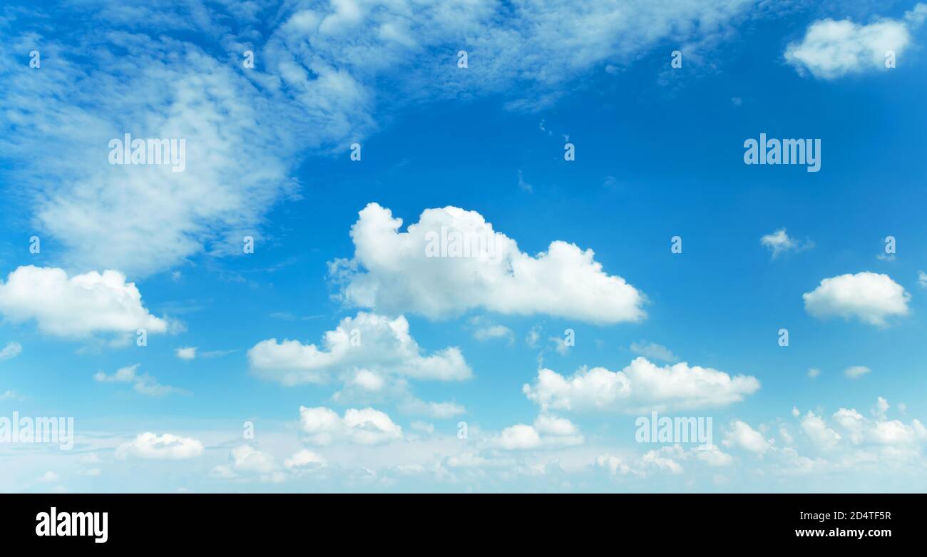 Sunny background, blue sky with white cumulus clouds Stock Photo - Alamy