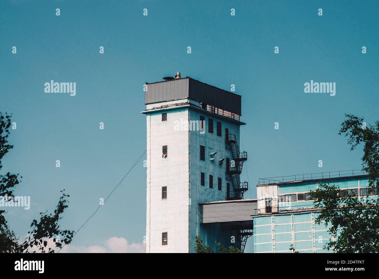 Giant tower of multistory production building. Picturesque old