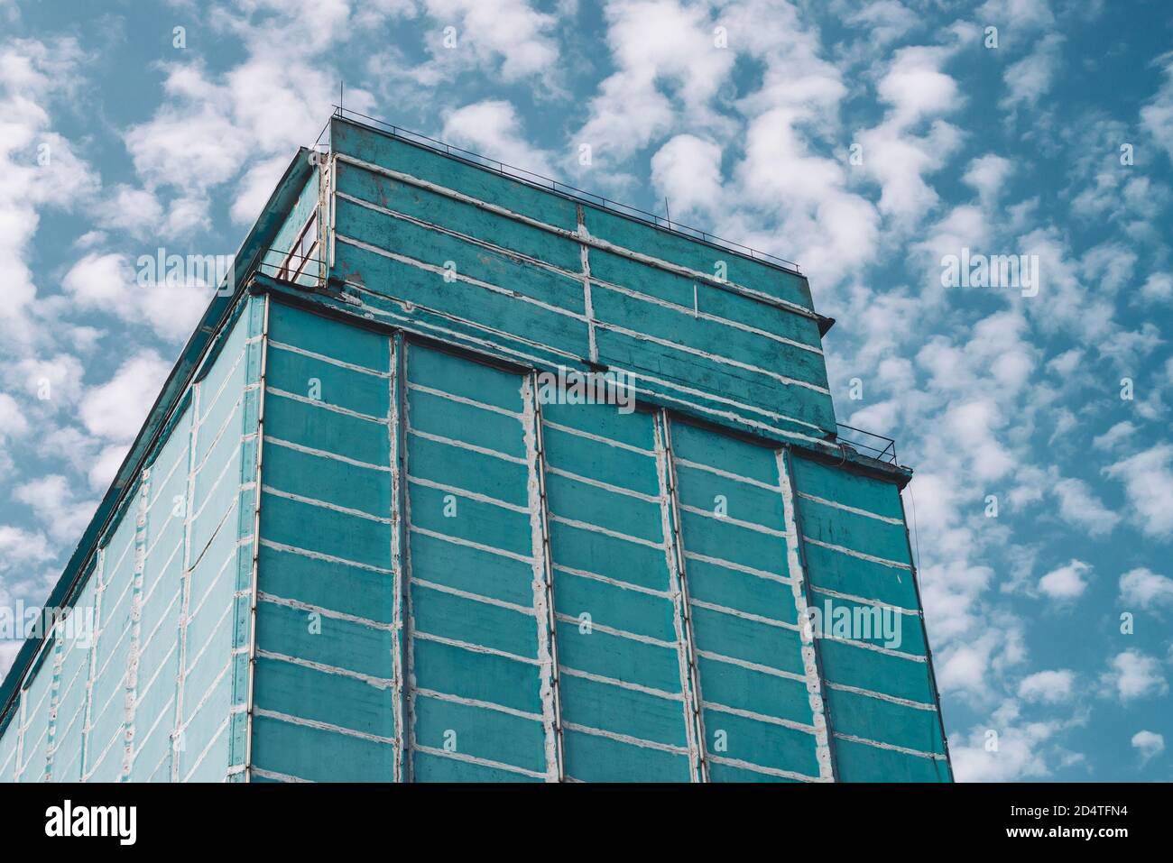 Giant wall of multistory production building. Picturesque old renovated